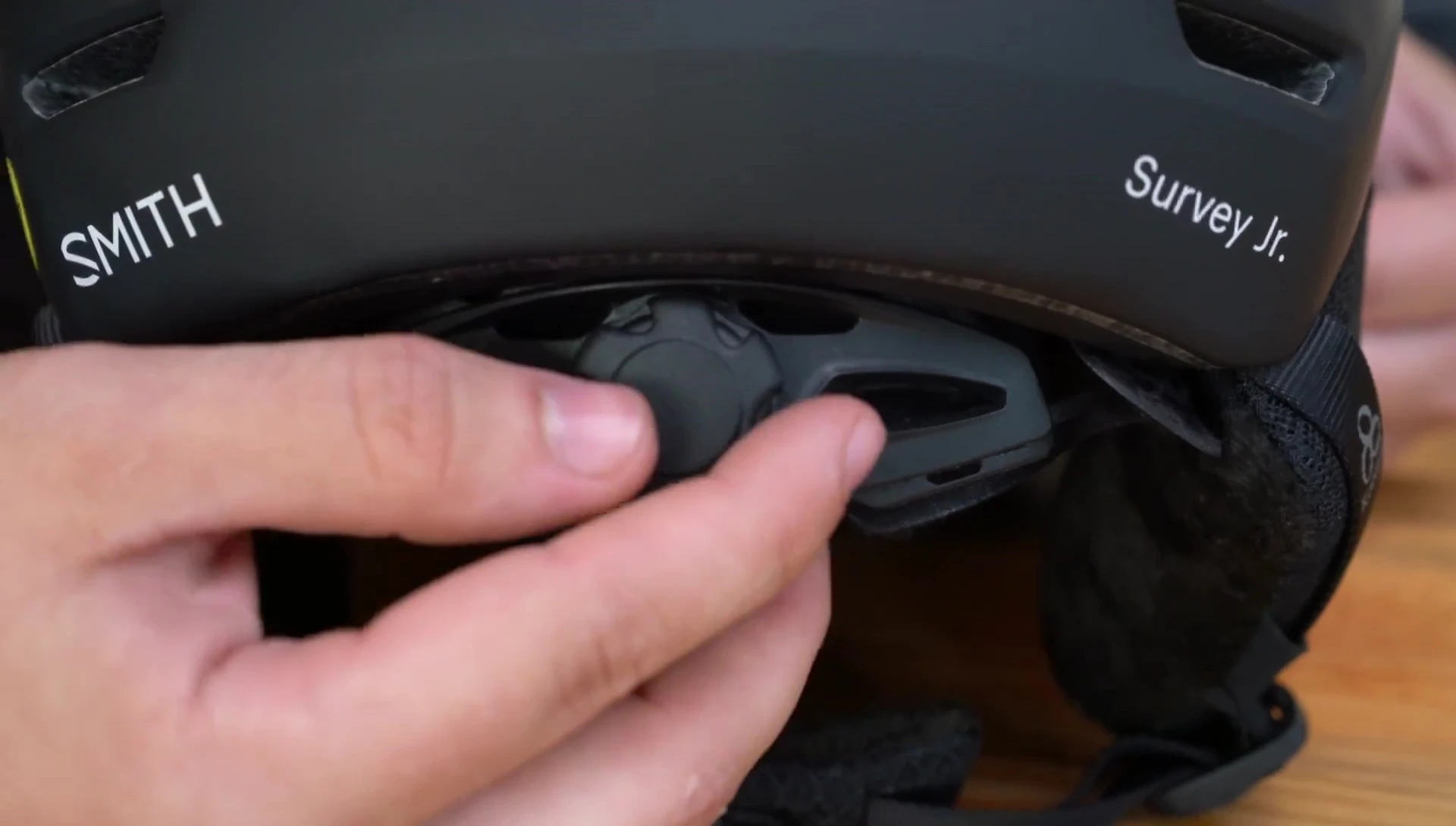 Shot of the adjustable dial fit system on the back of the helmet.