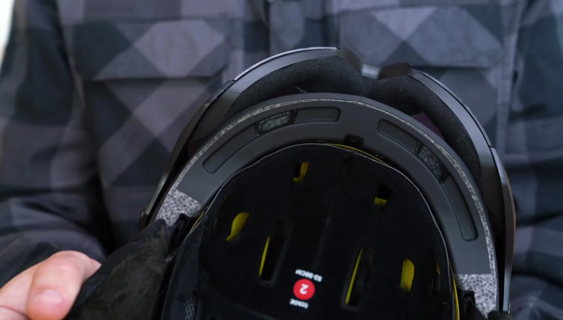 Shot highlighting the AirEvac ventilation system and visor integration.