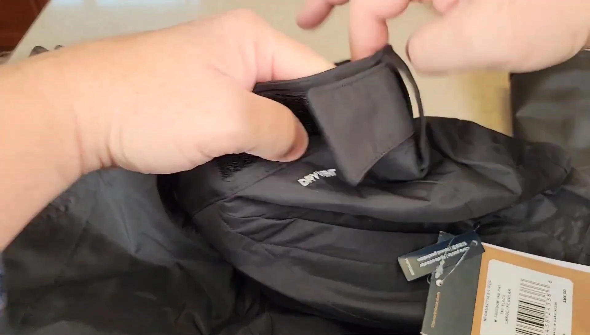 Detail shot of the velcro side straps for waist adjustment.
