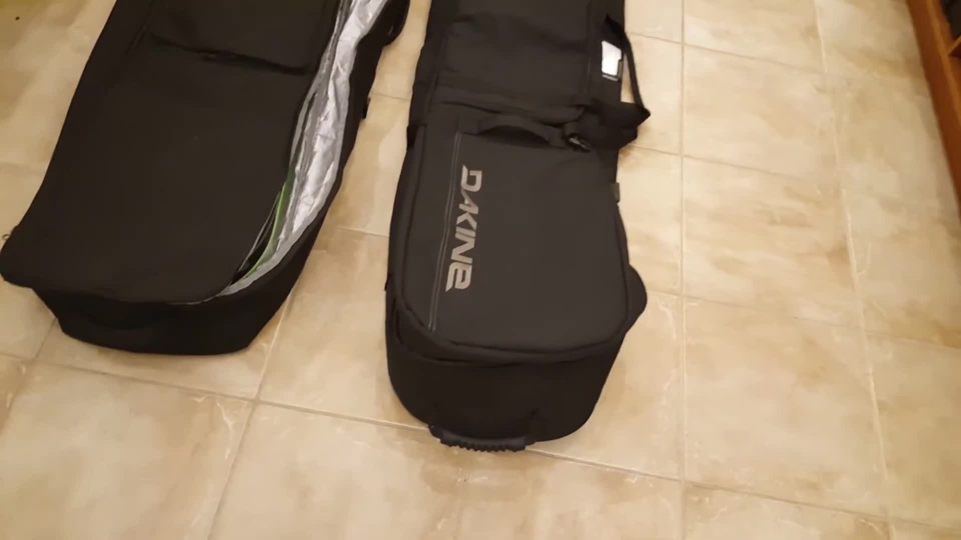 The bag standing tall next to another bag for size comparison