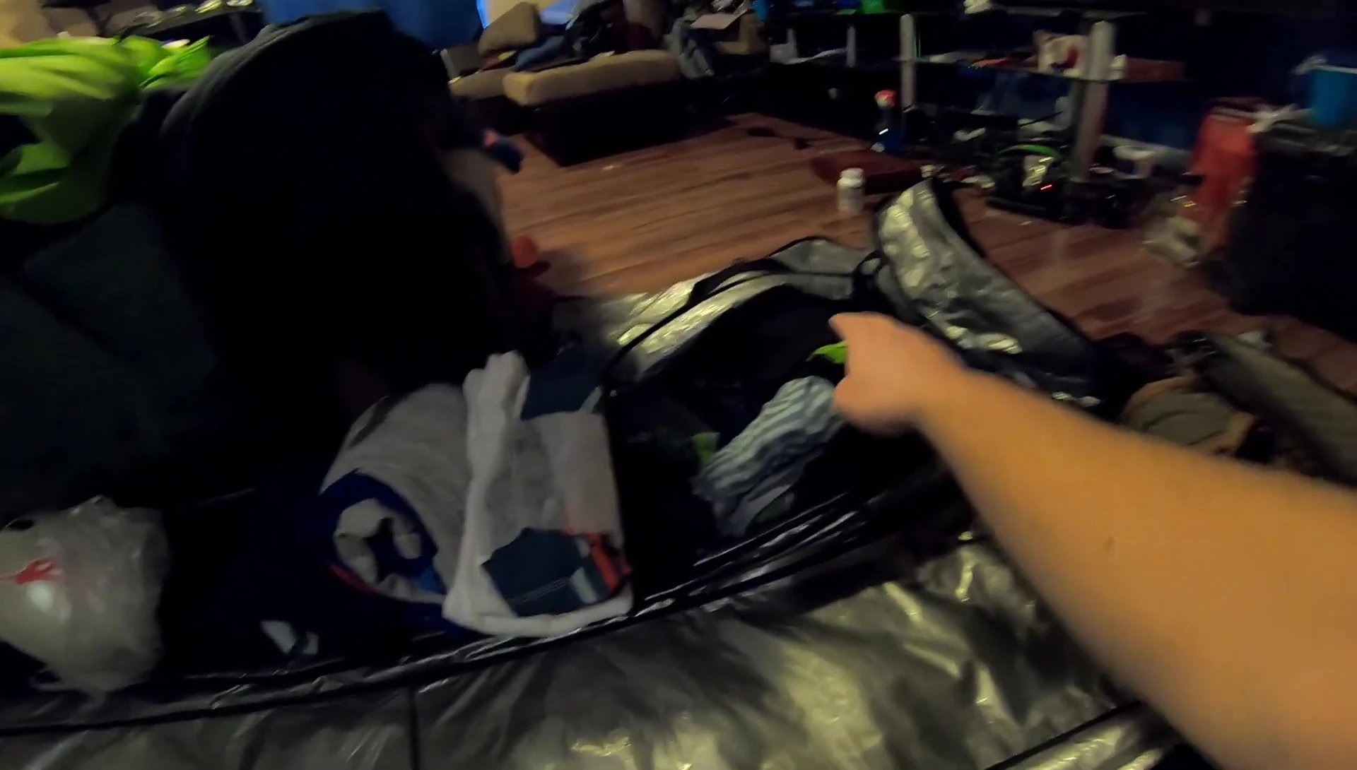Laying out clothes and other essential items for packing.