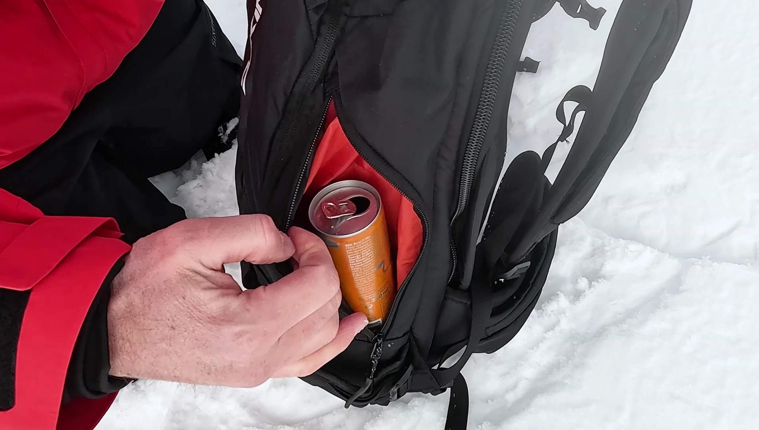 Side pocket of the backpack showing a packed lunch.