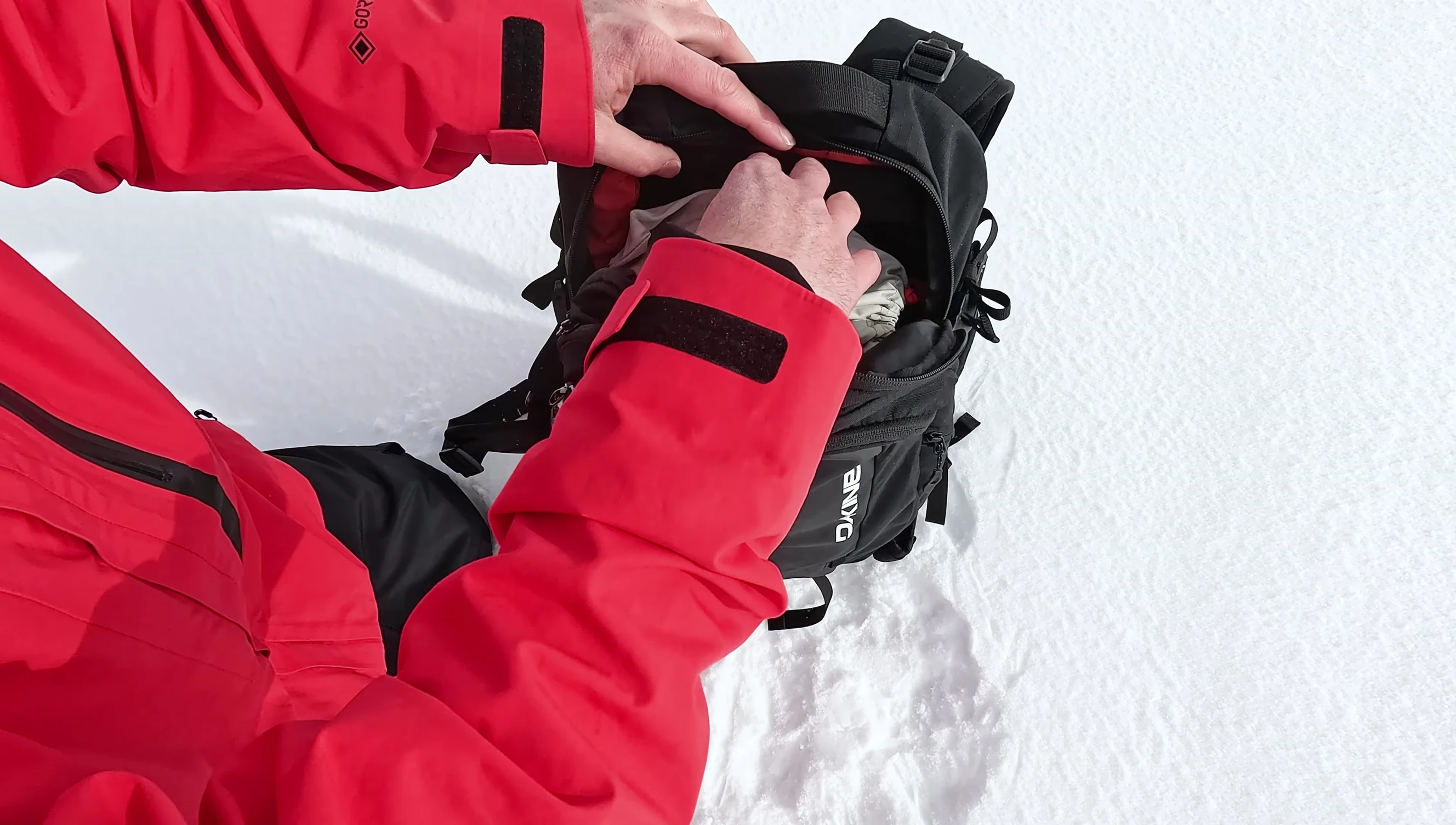 Close-up of the padded goggle pocket inside the backpack lid.