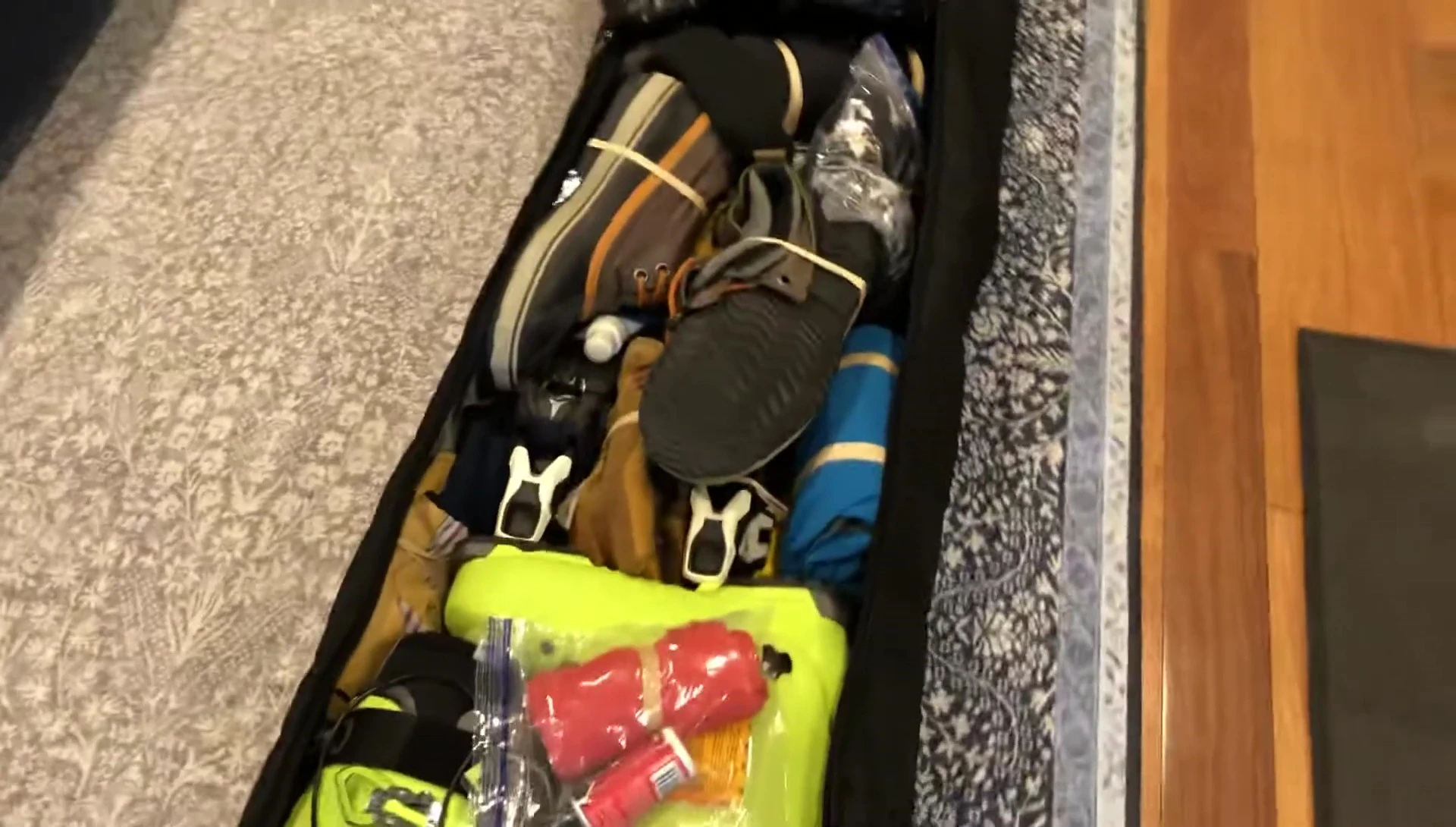 Inside view of the bag fully packed with skis, boots, and other gear.