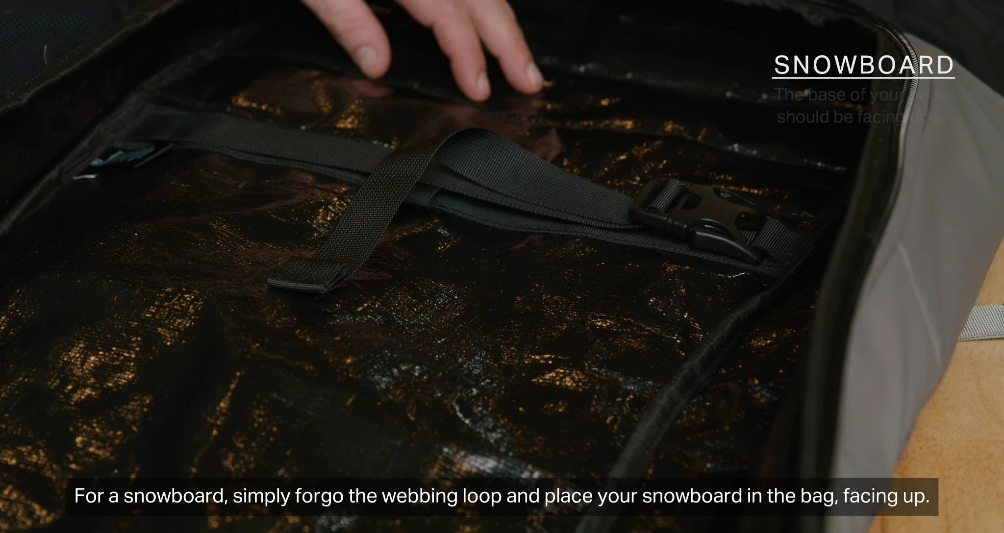 Snowboard secured in the bag.
