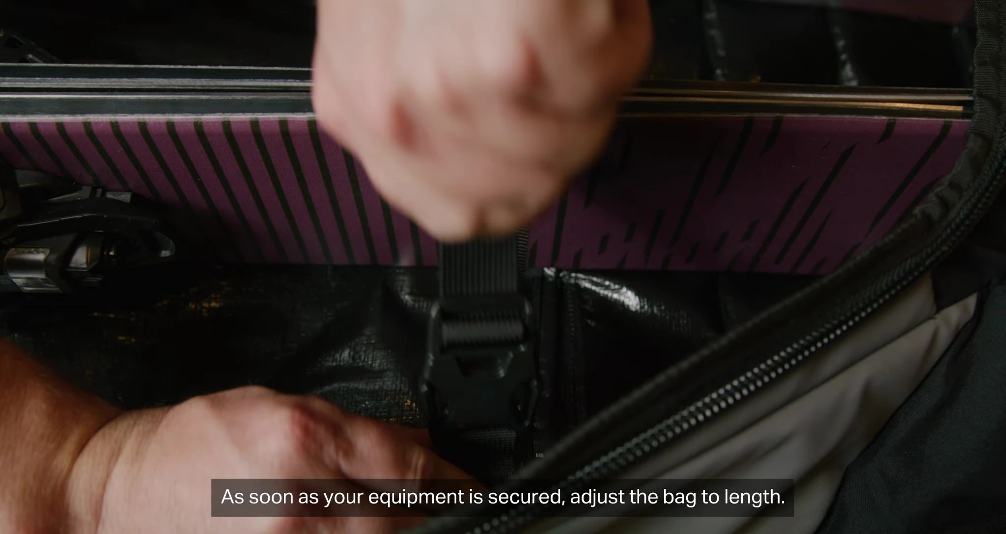 Rolling the padded top towards the ski tips.
