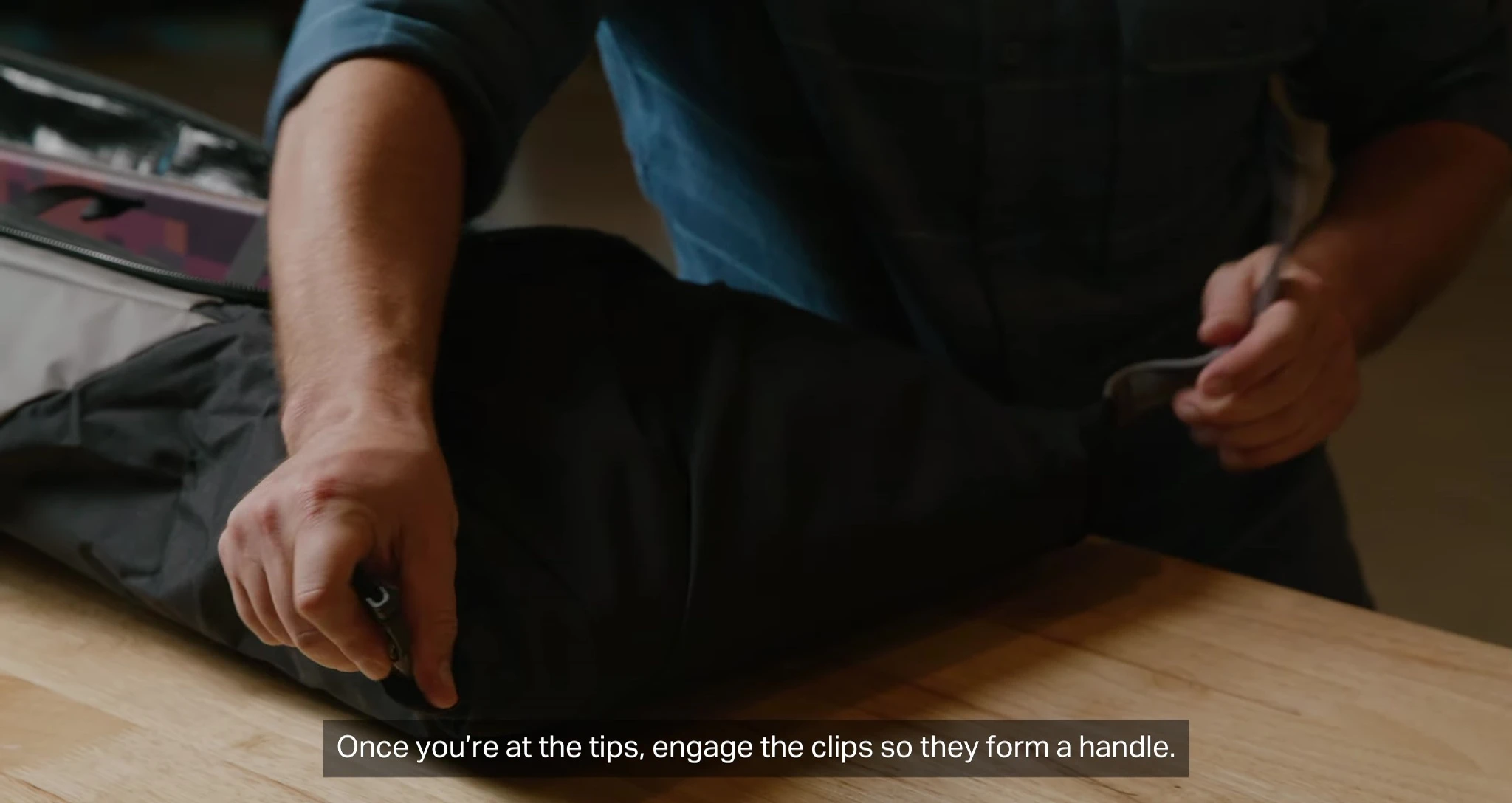 Engaging the clips to form a handle.
