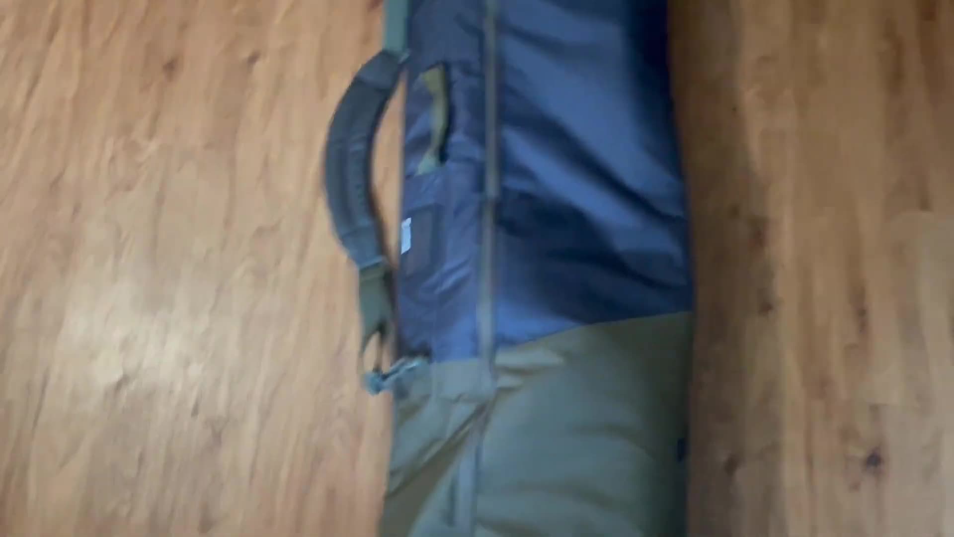 Close-up shot of the carrying strap and name card slot.