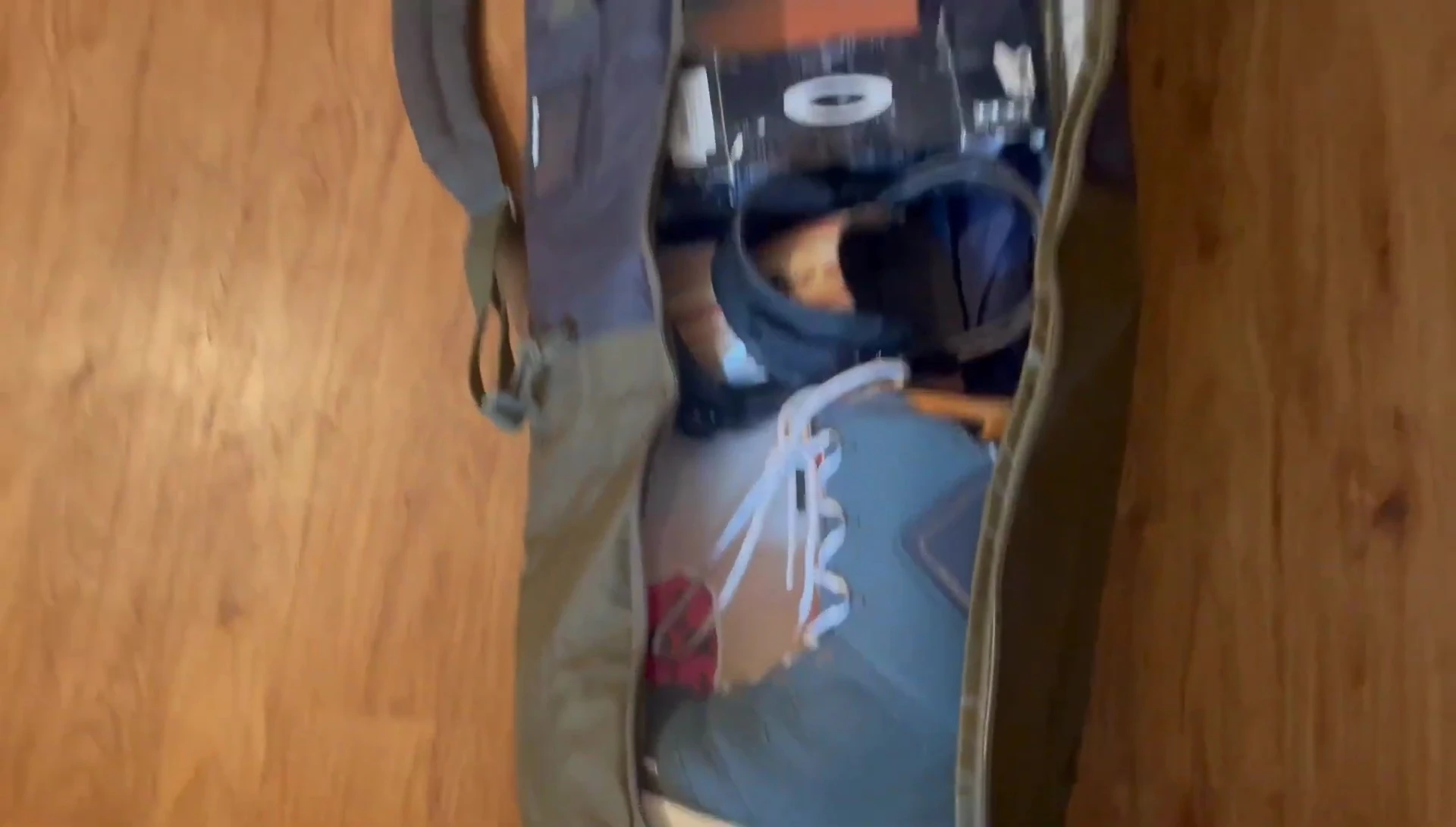 The reviewer discussing the size option for the bag.