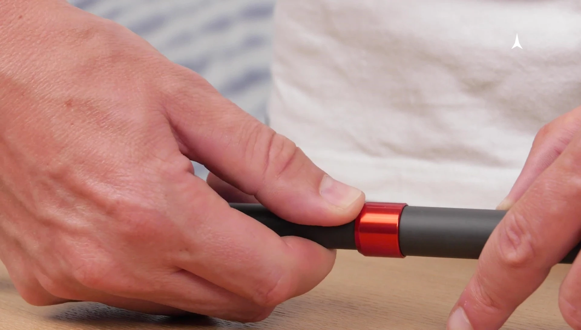 Demonstration of pushing the button to release the cable tension