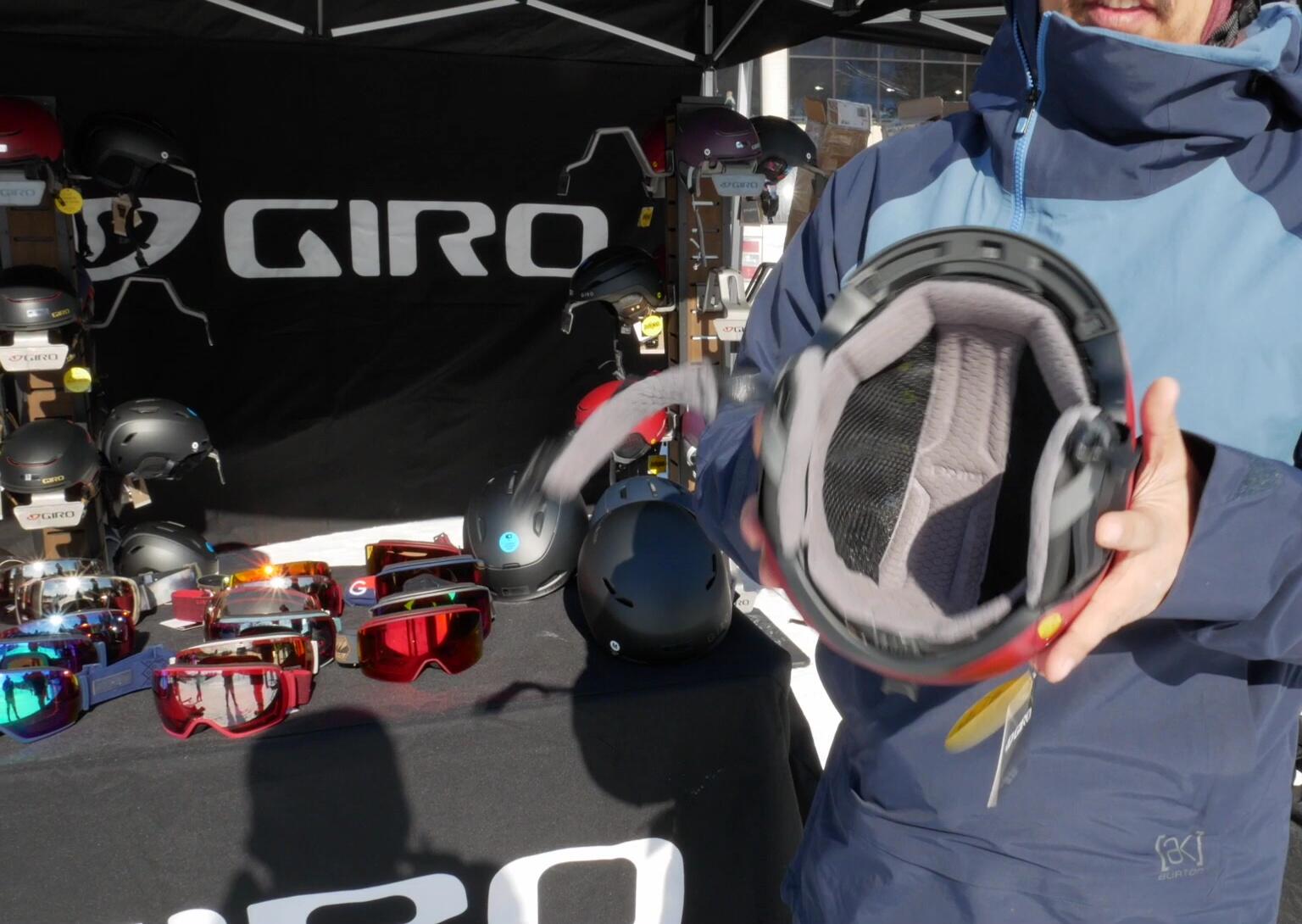 Someone holding up the Giro Jackson helmet to highlight its lightweight nature.