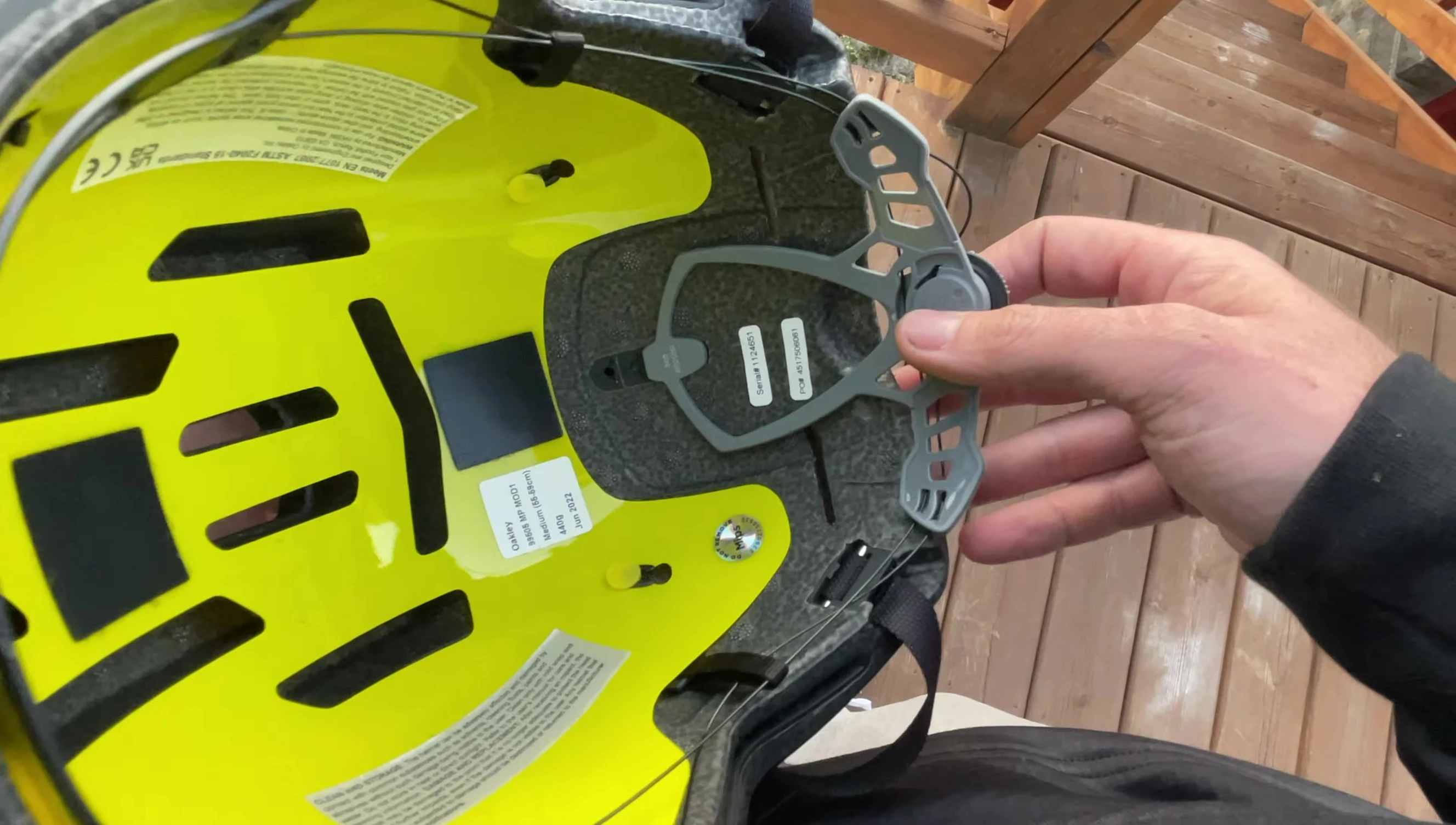 The speaker showing his head measurement.