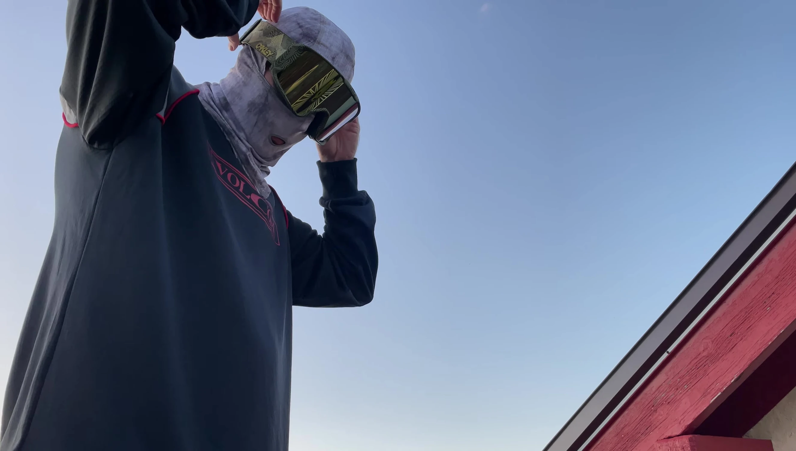 The speaker putting on the helmet with goggles underneath.