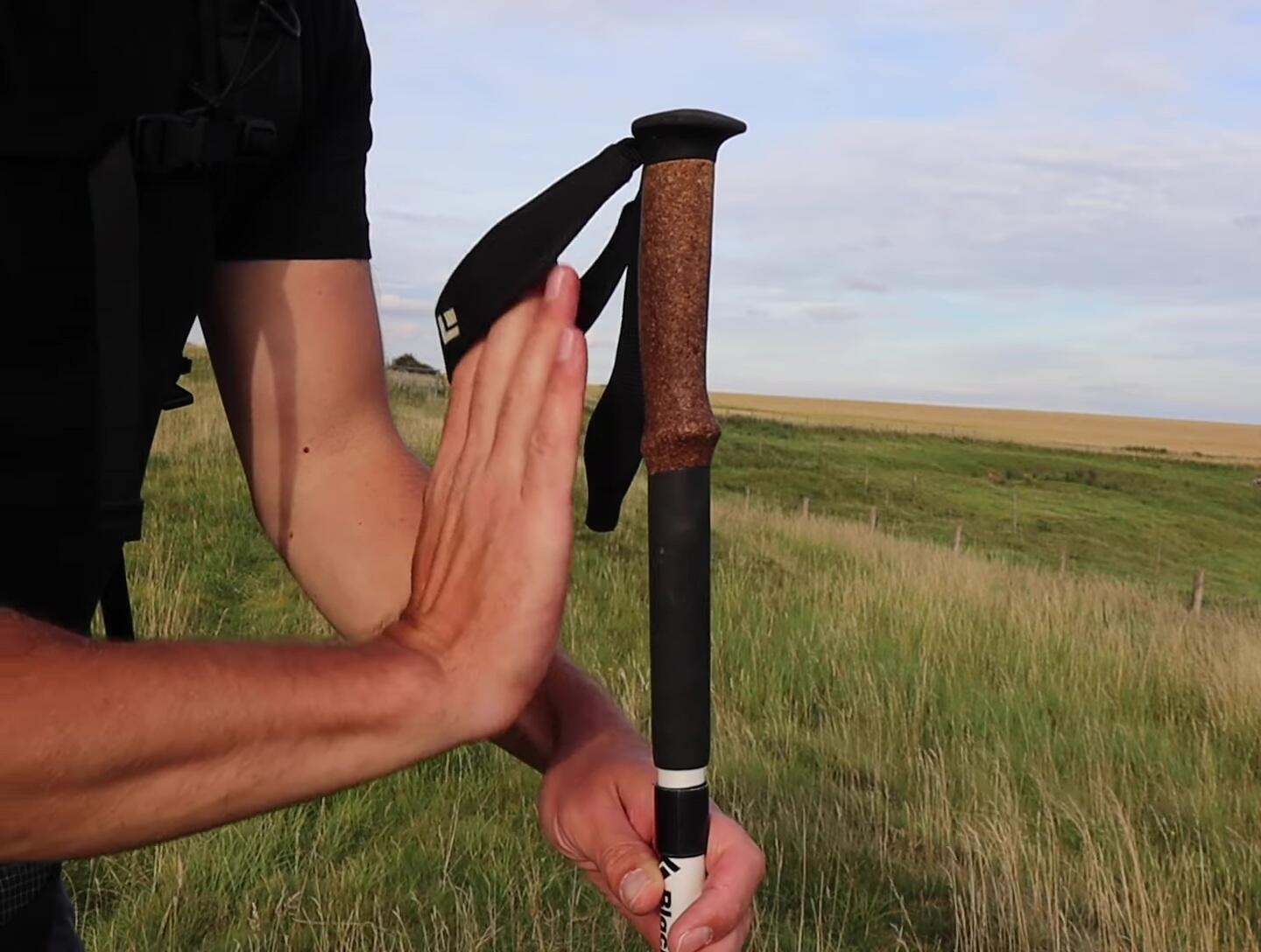Hiker demonstrating alternative wrist strap technique