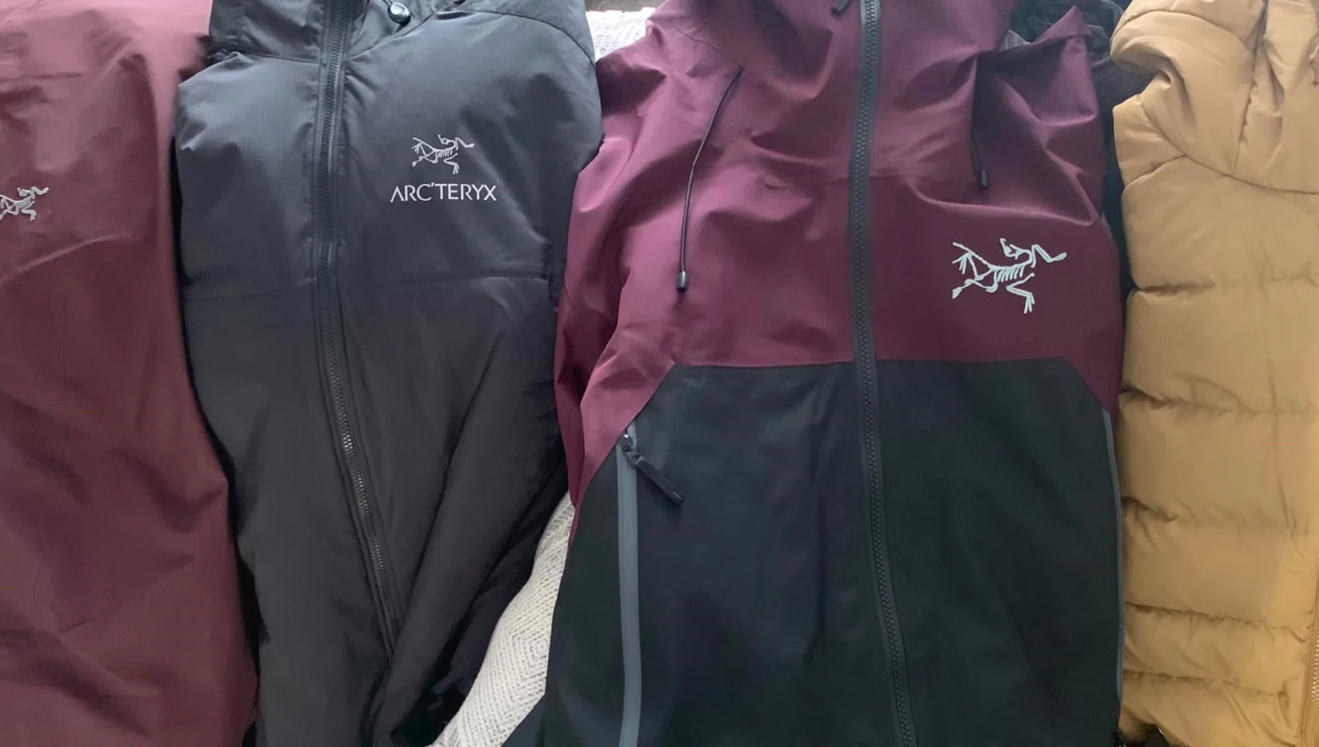 The Arc'teryx Sabre AR Jacket in action during a snowy condition