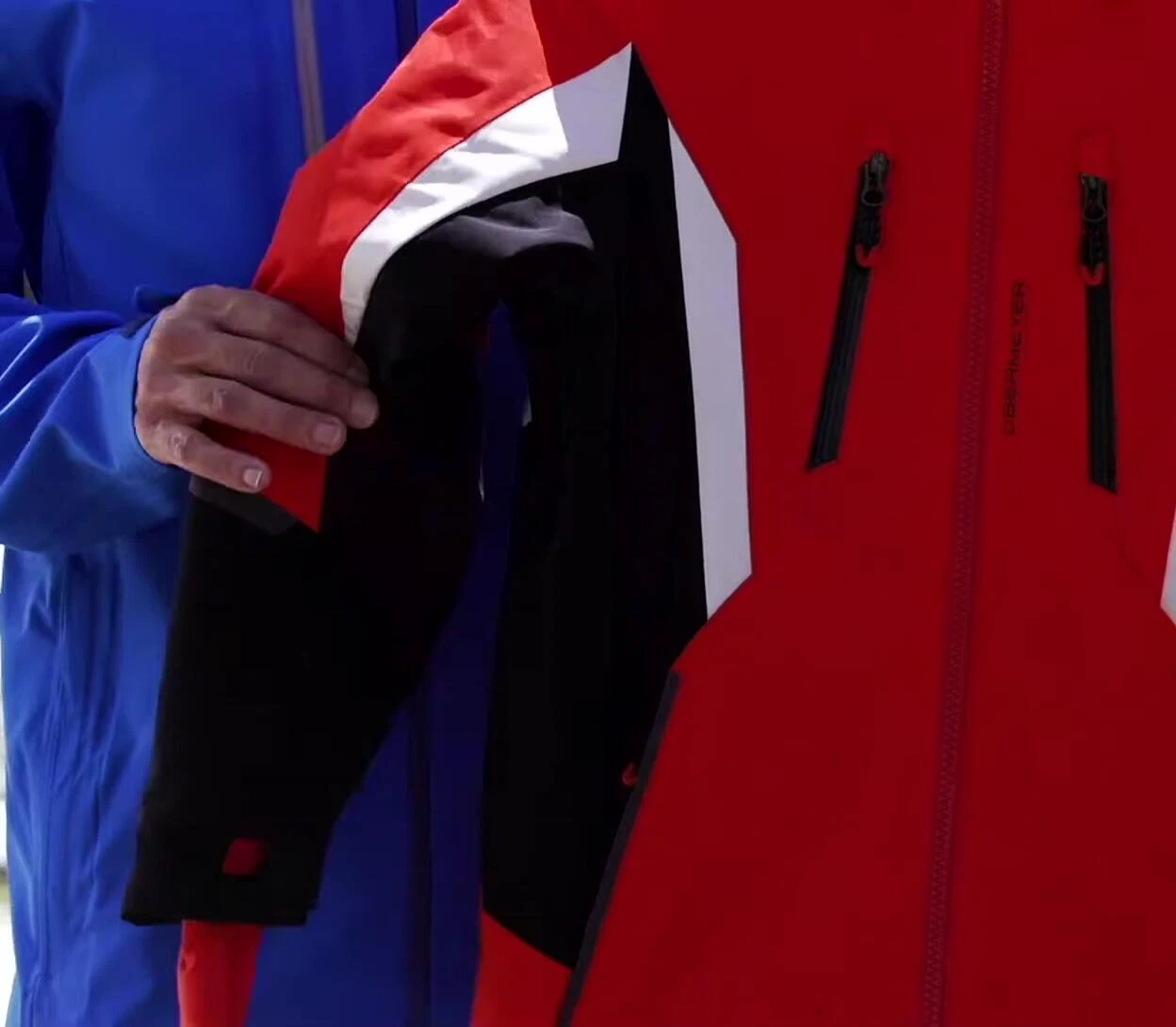 Close-up of the jacket's fabric showcasing its texture and stretch.