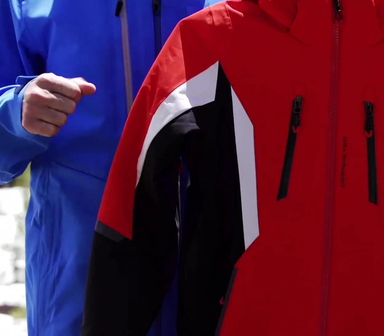 A teen skier demonstrating the jacket's flexibility while skiing.