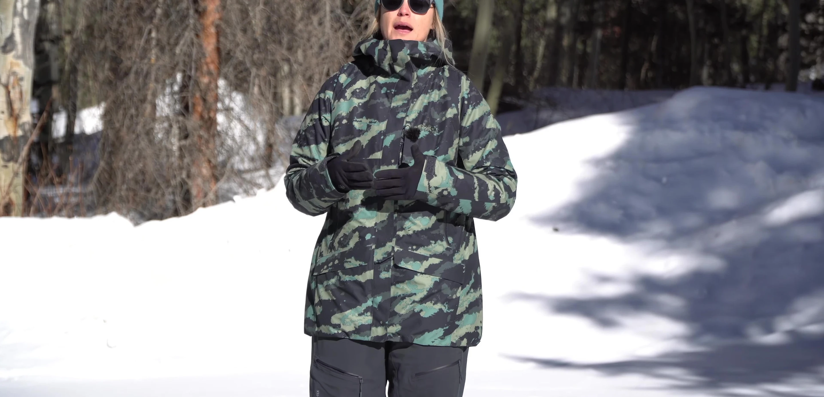The reviewer standing in a snowy, windy environment.