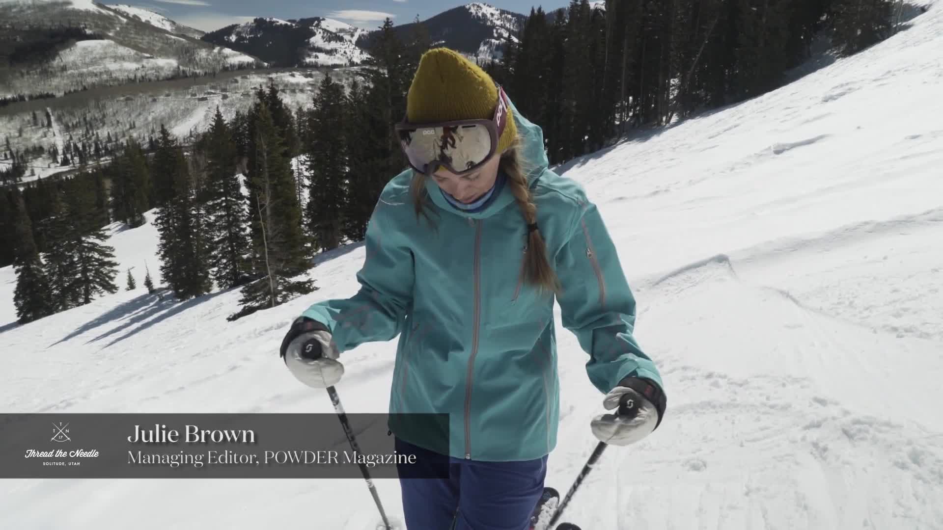 A full shot of the reviewer wearing the Spyder outfit while skiing.