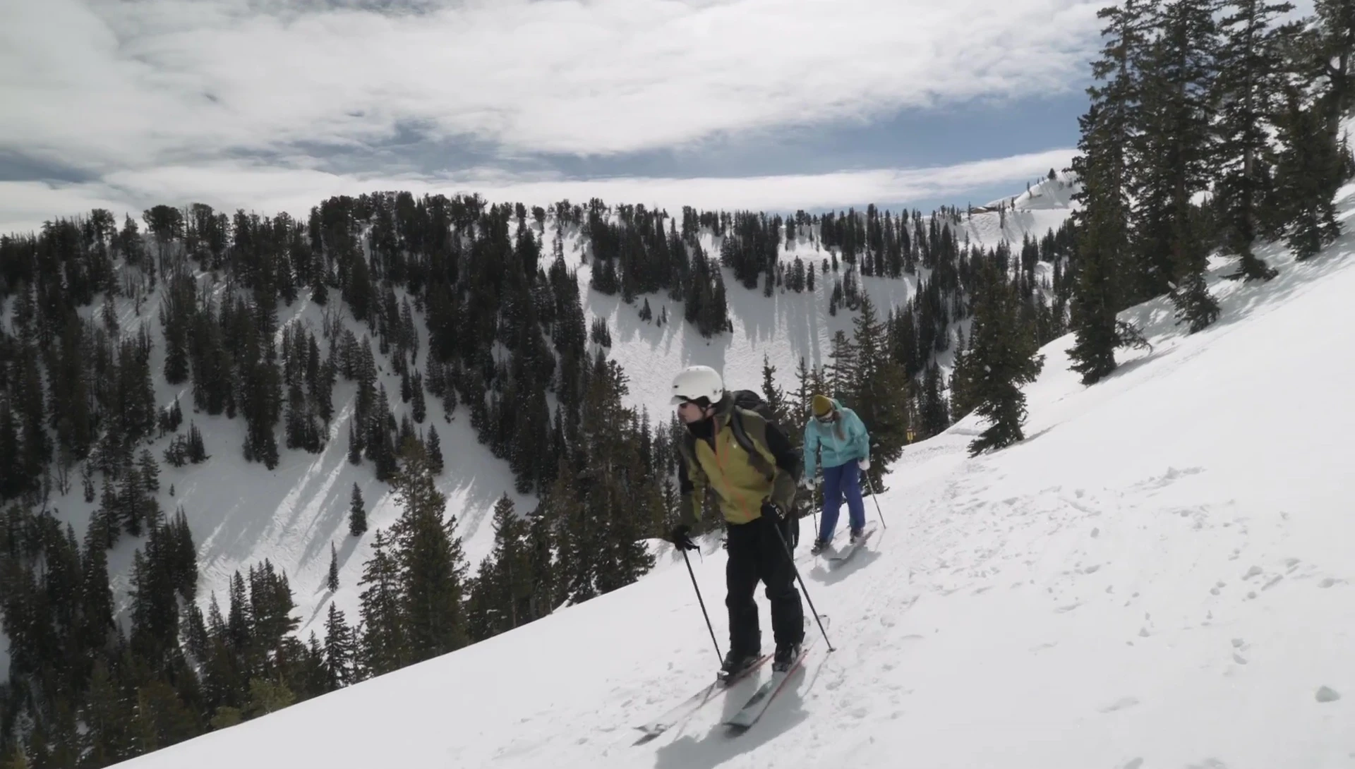 The reviewer demonstrating layering the jacket with a mid-layer.