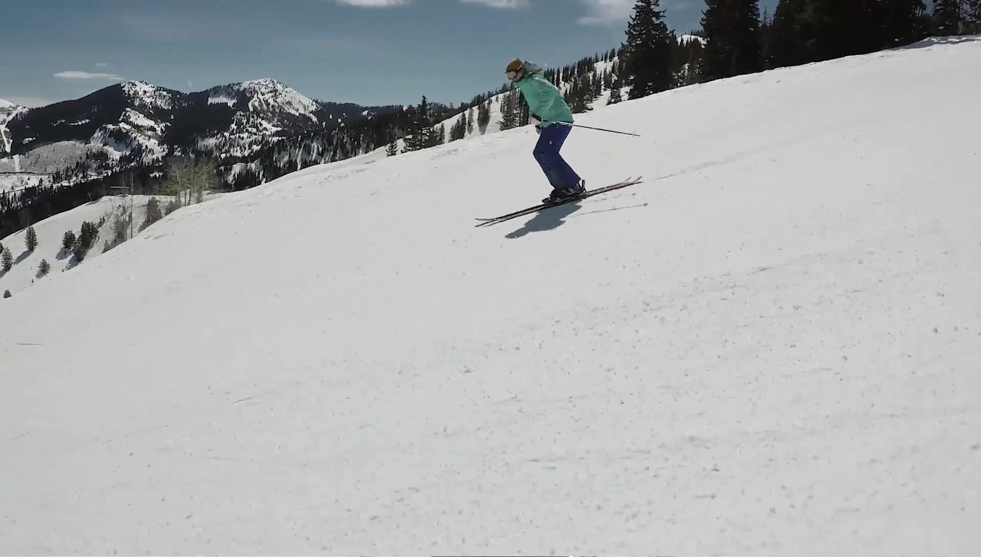 The reviewer skiing on a groomed run.