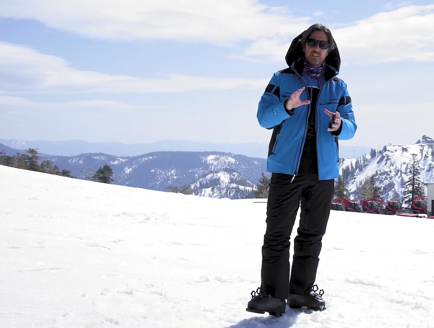 The reviewer demonstrating the flexibility of the pants.