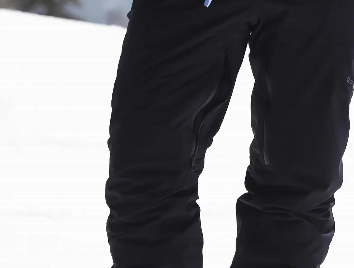 Close-up showing the scuff guard at the bottom of the pant leg.