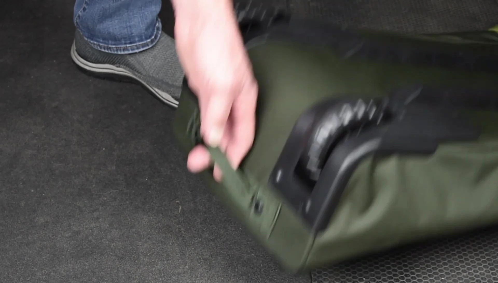Image highlighting the sturdy handles and wheels of the Dakine Low Roller.
