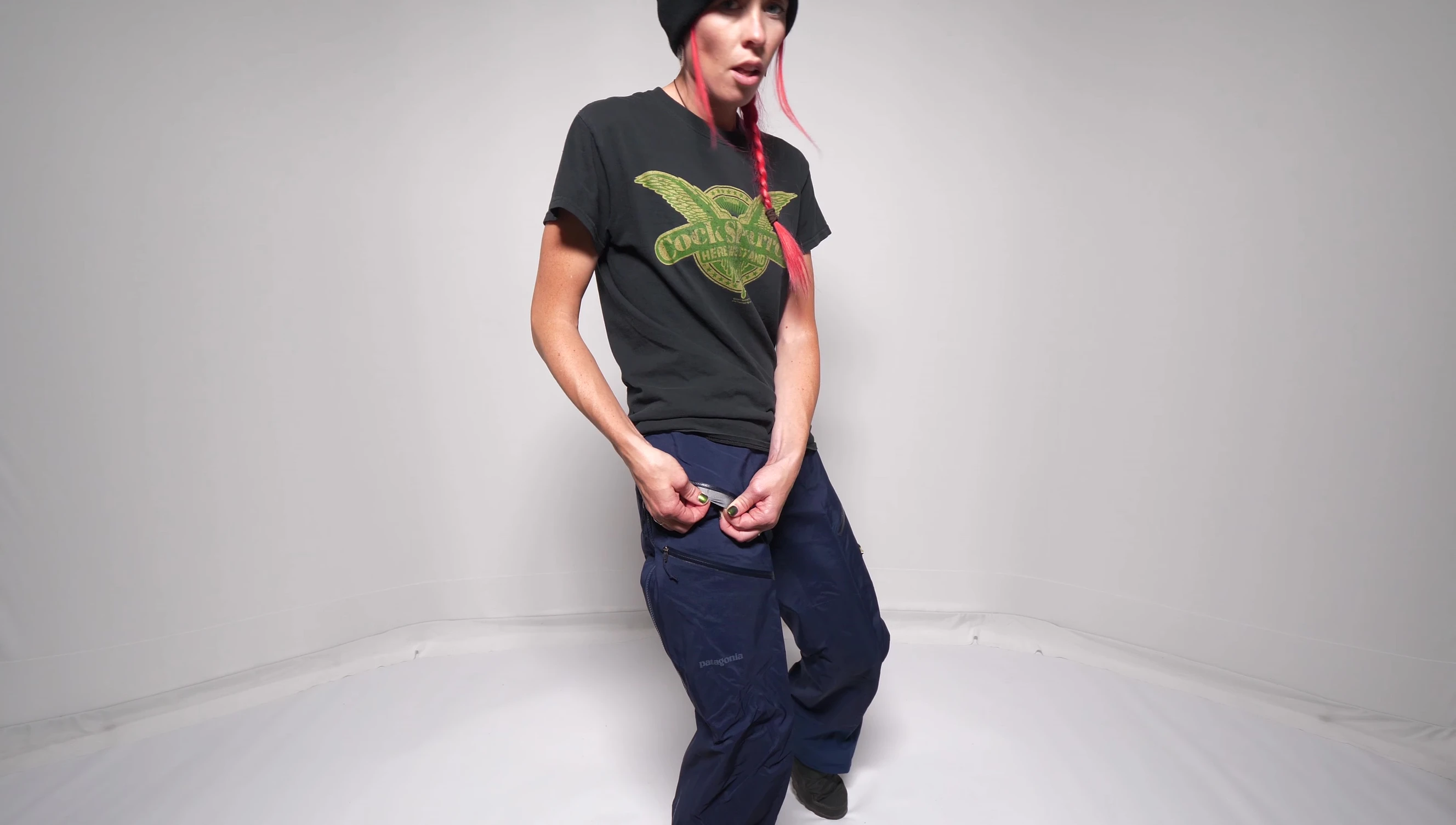 The reviewer demonstrating the small, lined pocket.