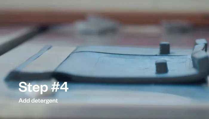 Set washer to a small cycle size, warm temperature, and regular wash cycle.