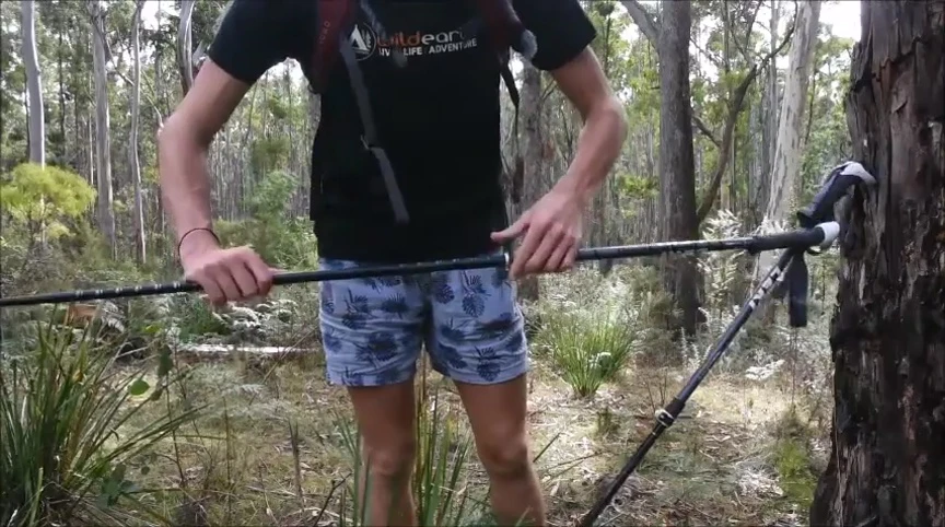 Close-up of the LEKI Makalu trekking poles showing the dual clip locking mechanism.