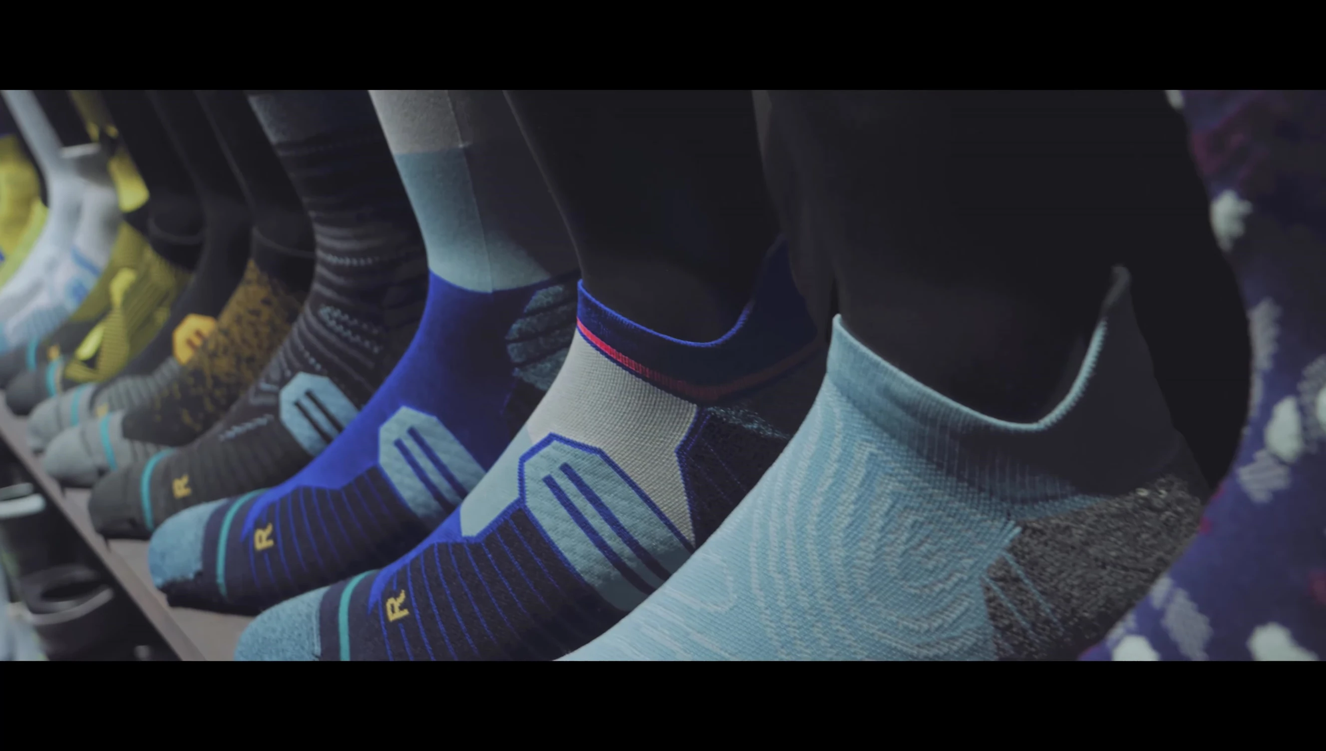 The presenter discussing the sustainability aspects of Stance Infinite socks.