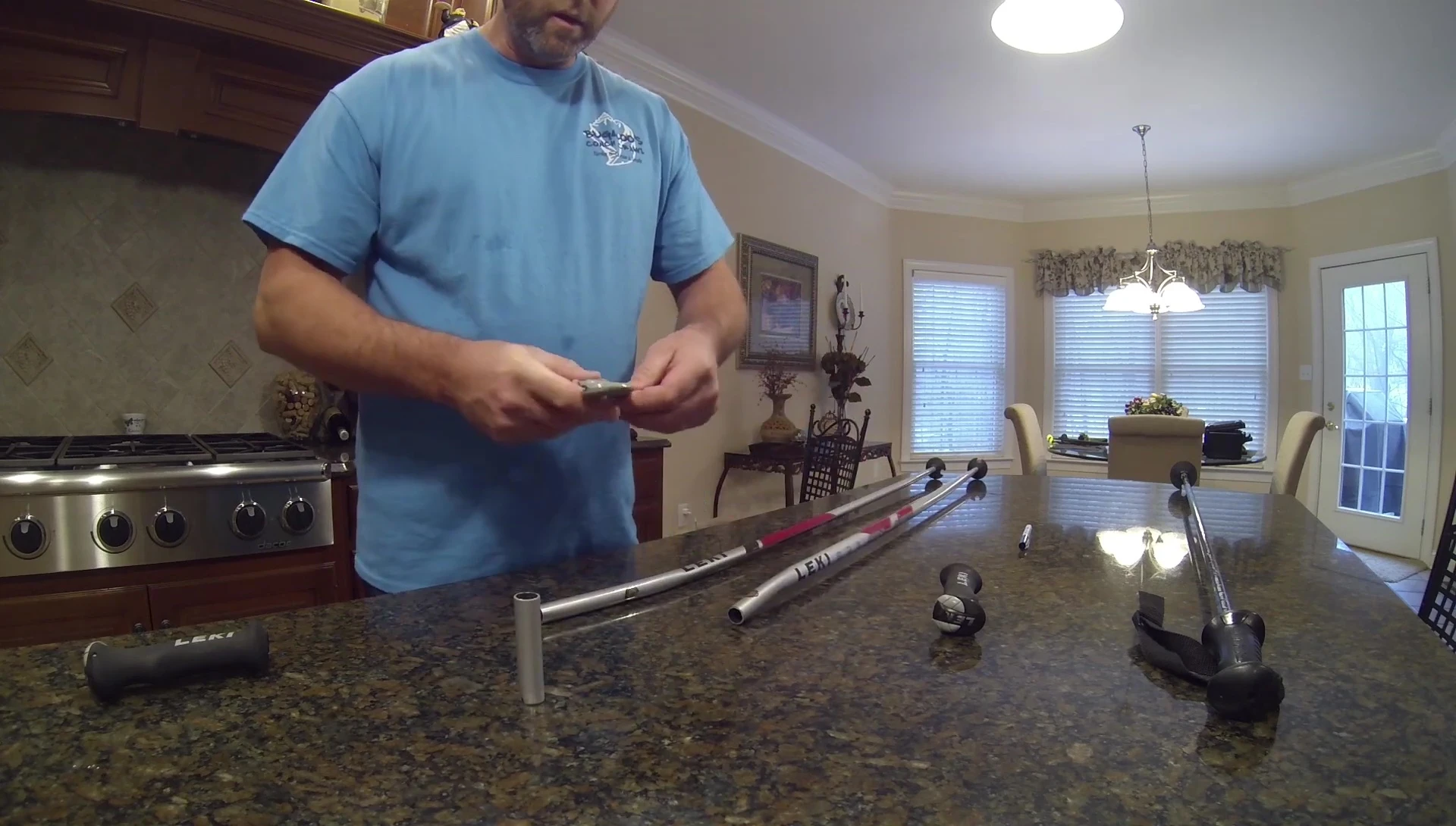 Finishing the cut end of the ski pole
