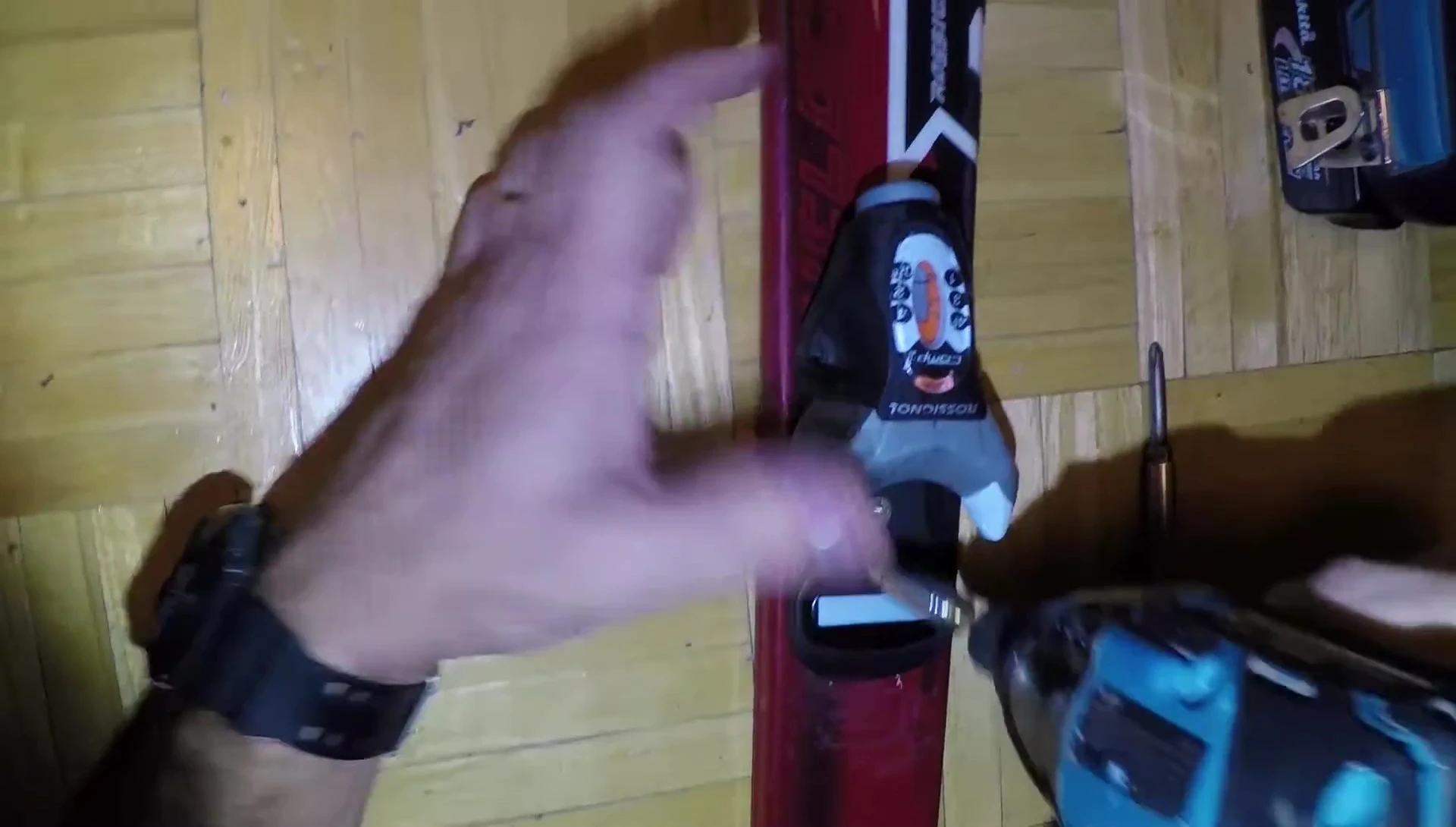 Installing the new ski bindings with a drill.