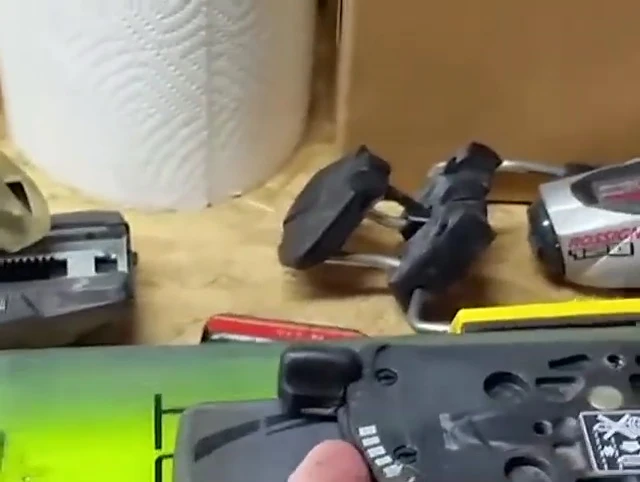 Speaker uses a screwdriver to show how the plate locks in place.