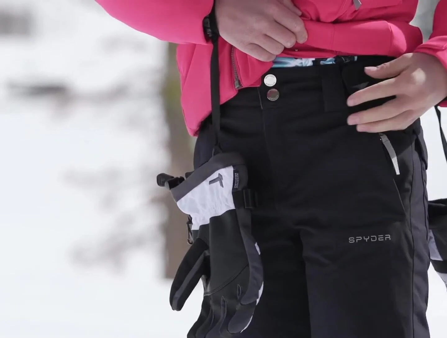 The girl adjusting the Velcro straps.