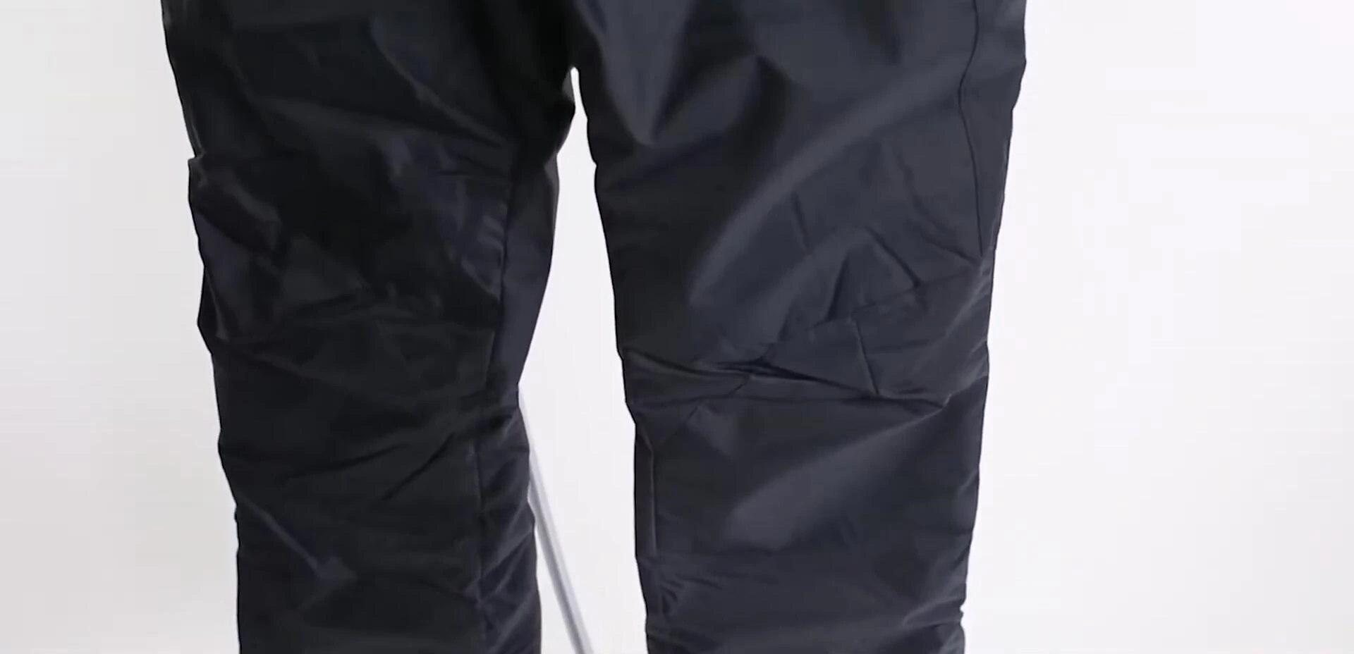 Close-up image of the pants' material highlighting the nylon shell.