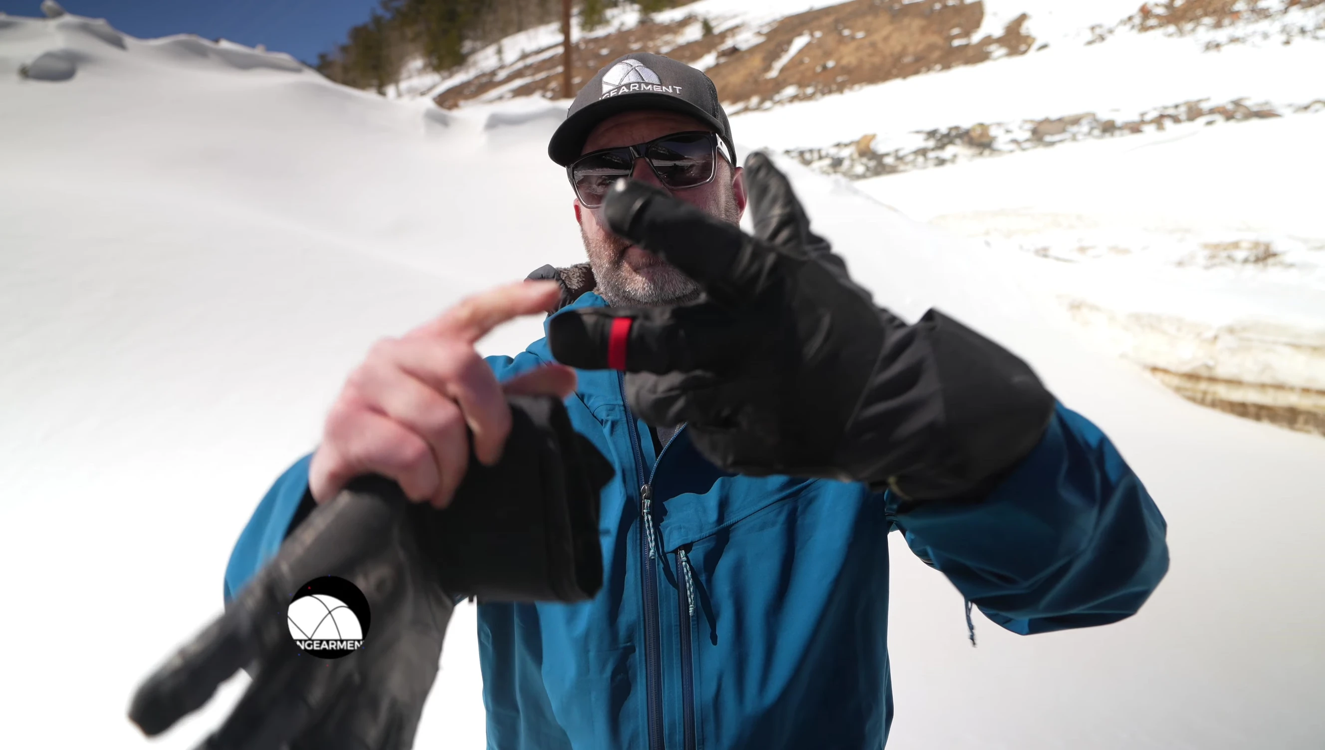 The reviewer demonstrating the fit of the gloves on their hands.