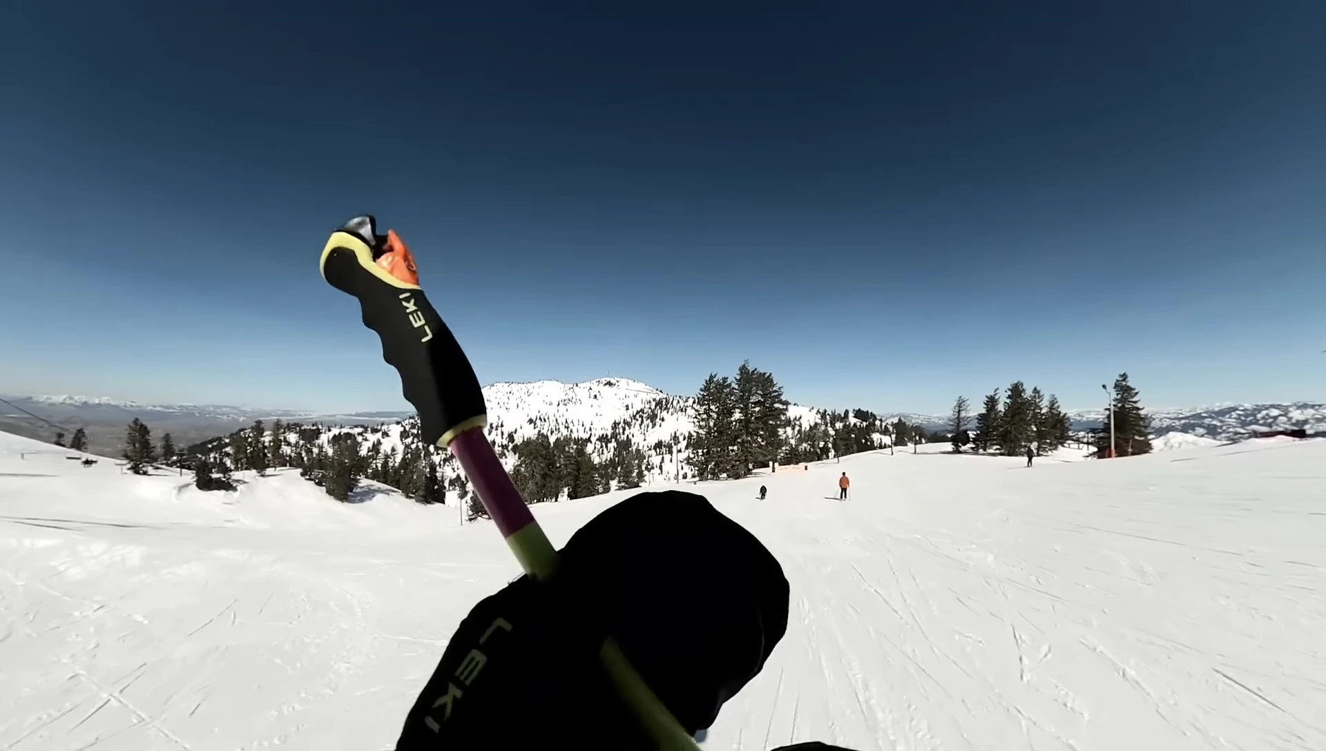 Footage showing the speaker effortlessly clipping the poles into the mittens.