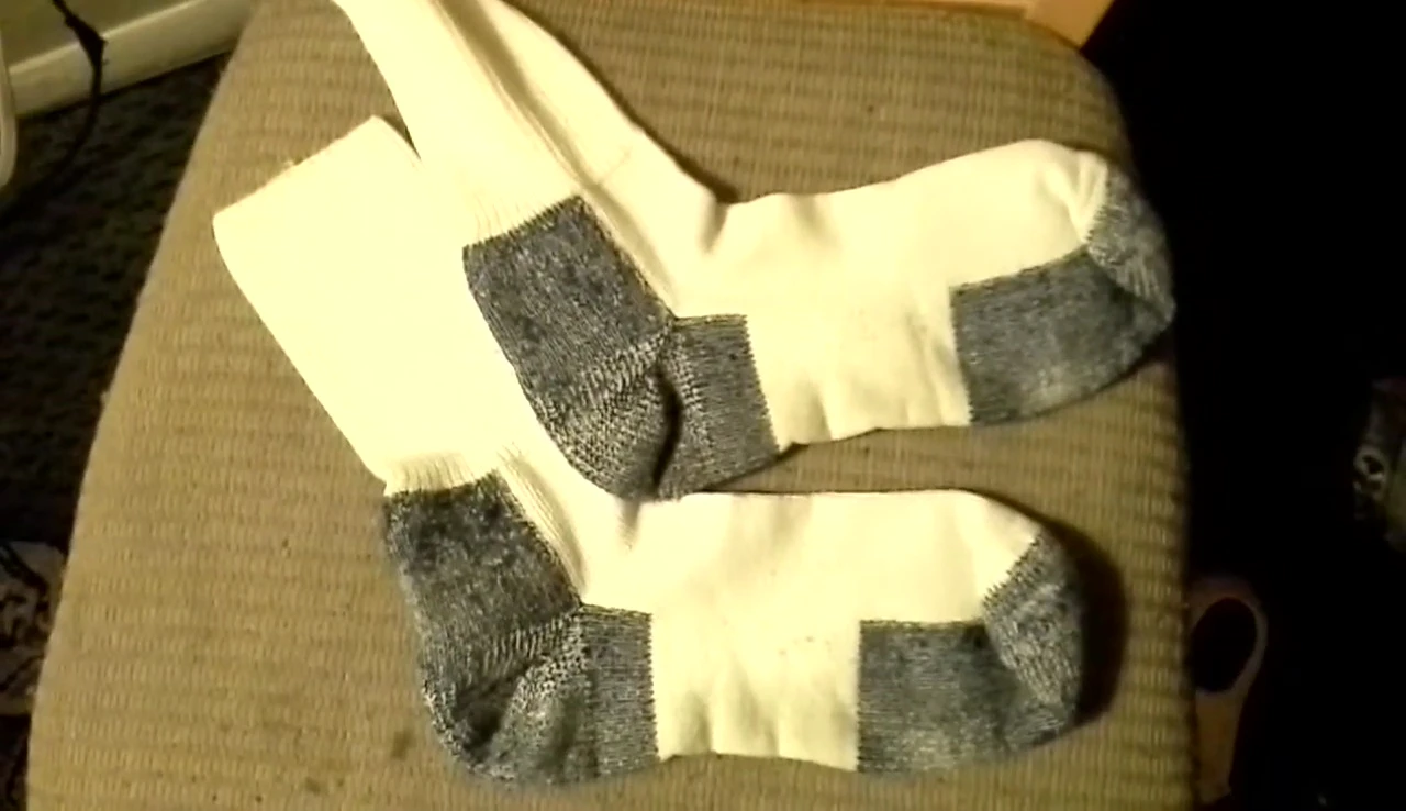 A general shot of the reviewer talking about the value of the socks