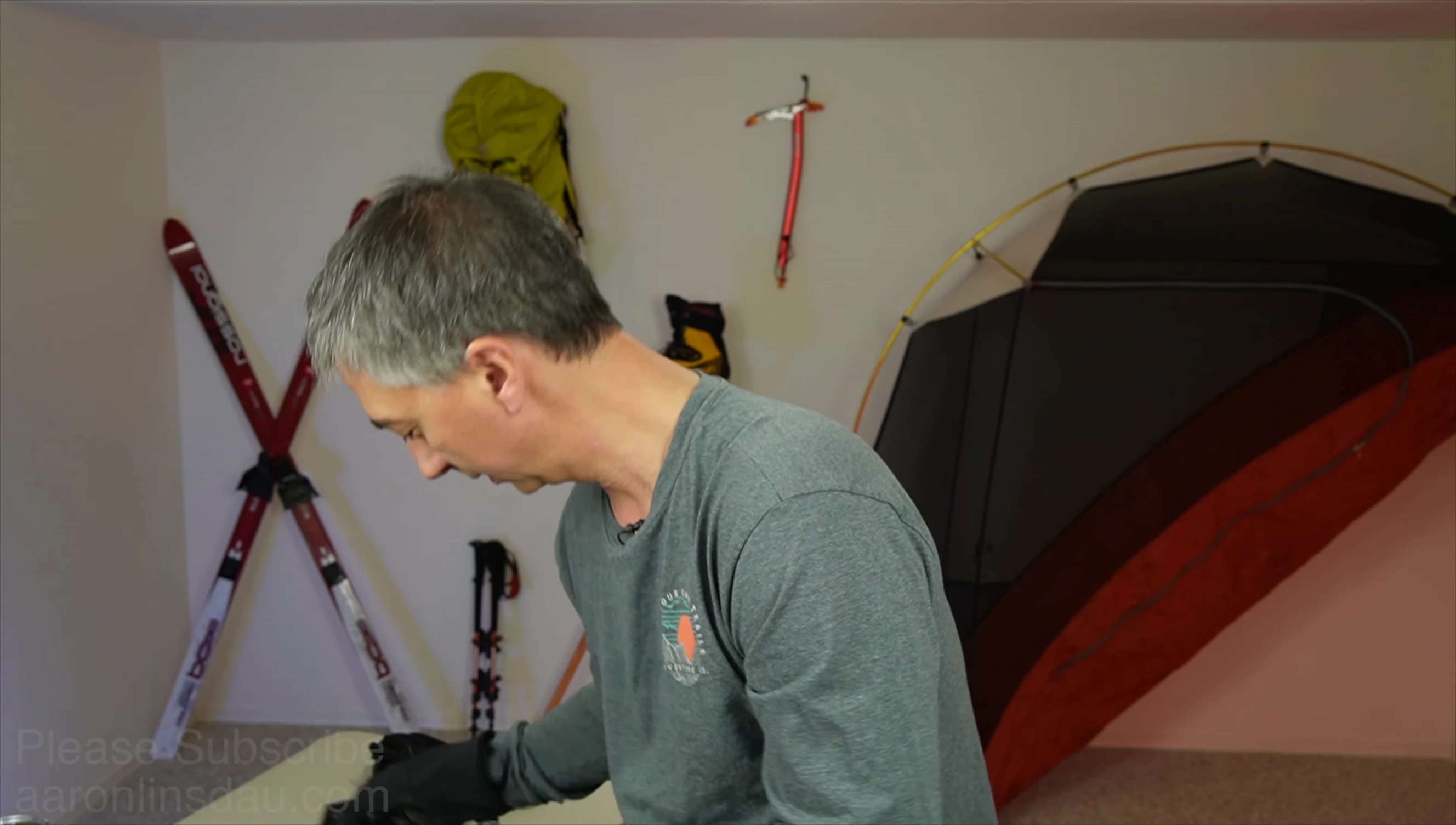 Reviewer holding up a pair of XL Stormtracker gloves