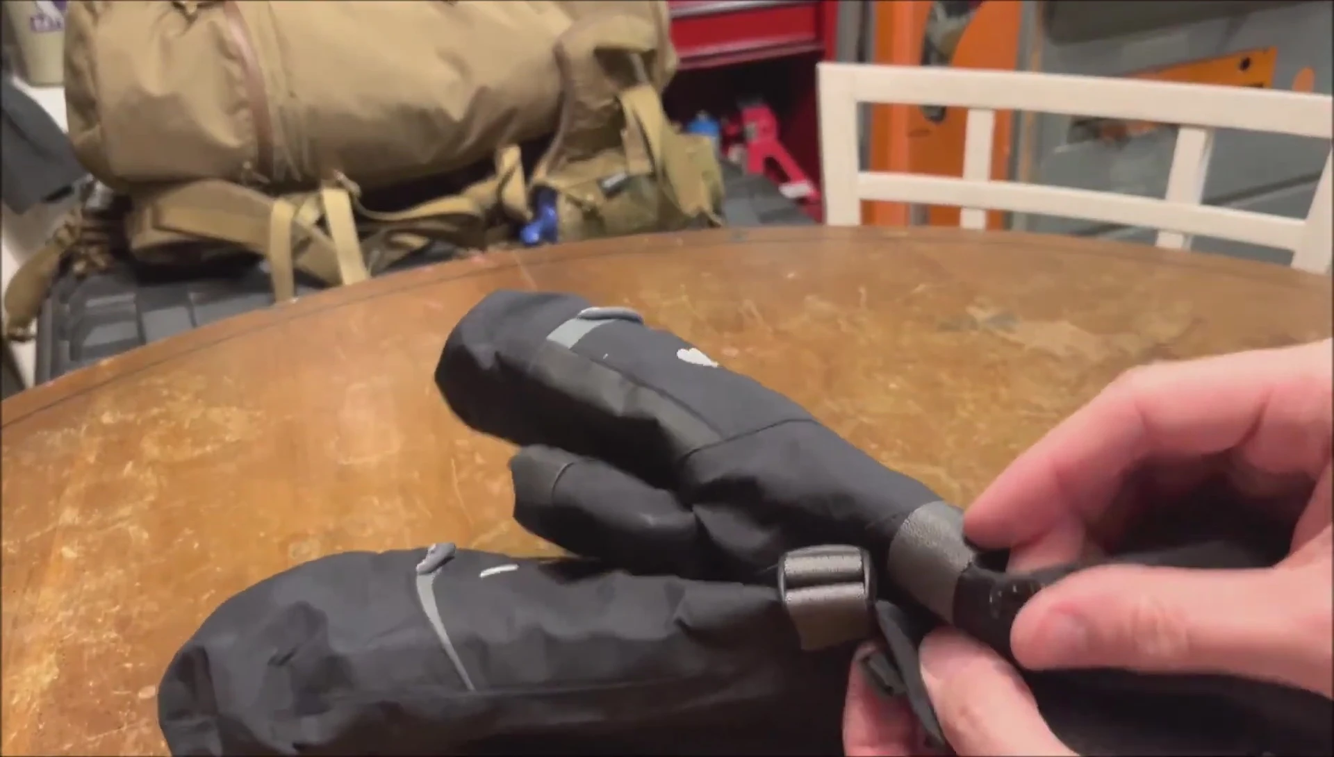Final shot of the reviewer holding the mitts.