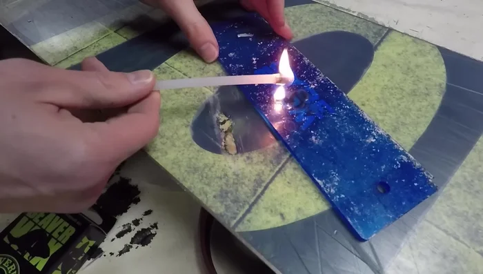 Melt P-Tex into the gouge using a lighter, ensuring you overfill the area. Let it dry for 20 minutes.