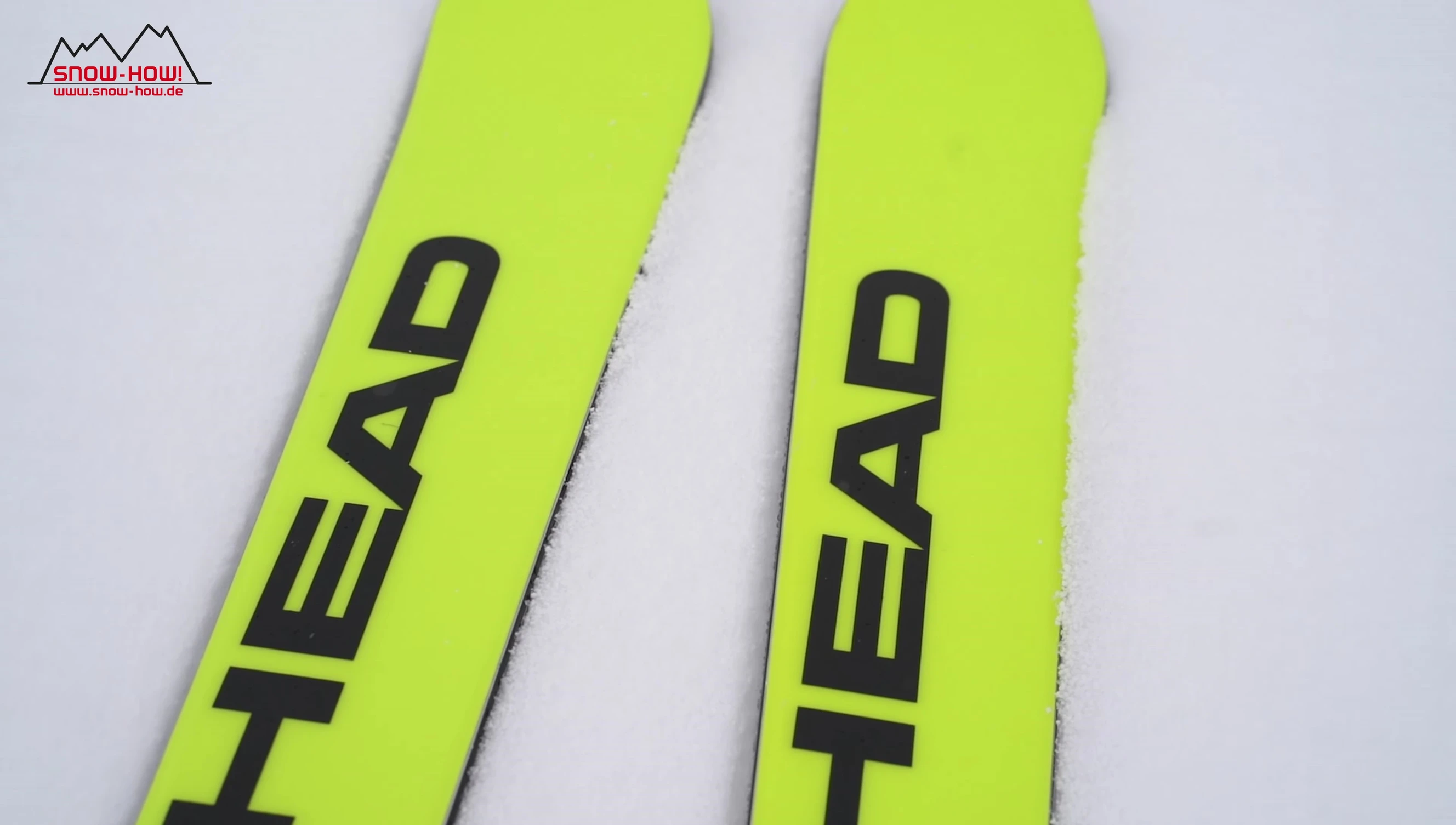 Skier demonstrating precise carving on Head Worldcup Rebels e-Race Pro skis.