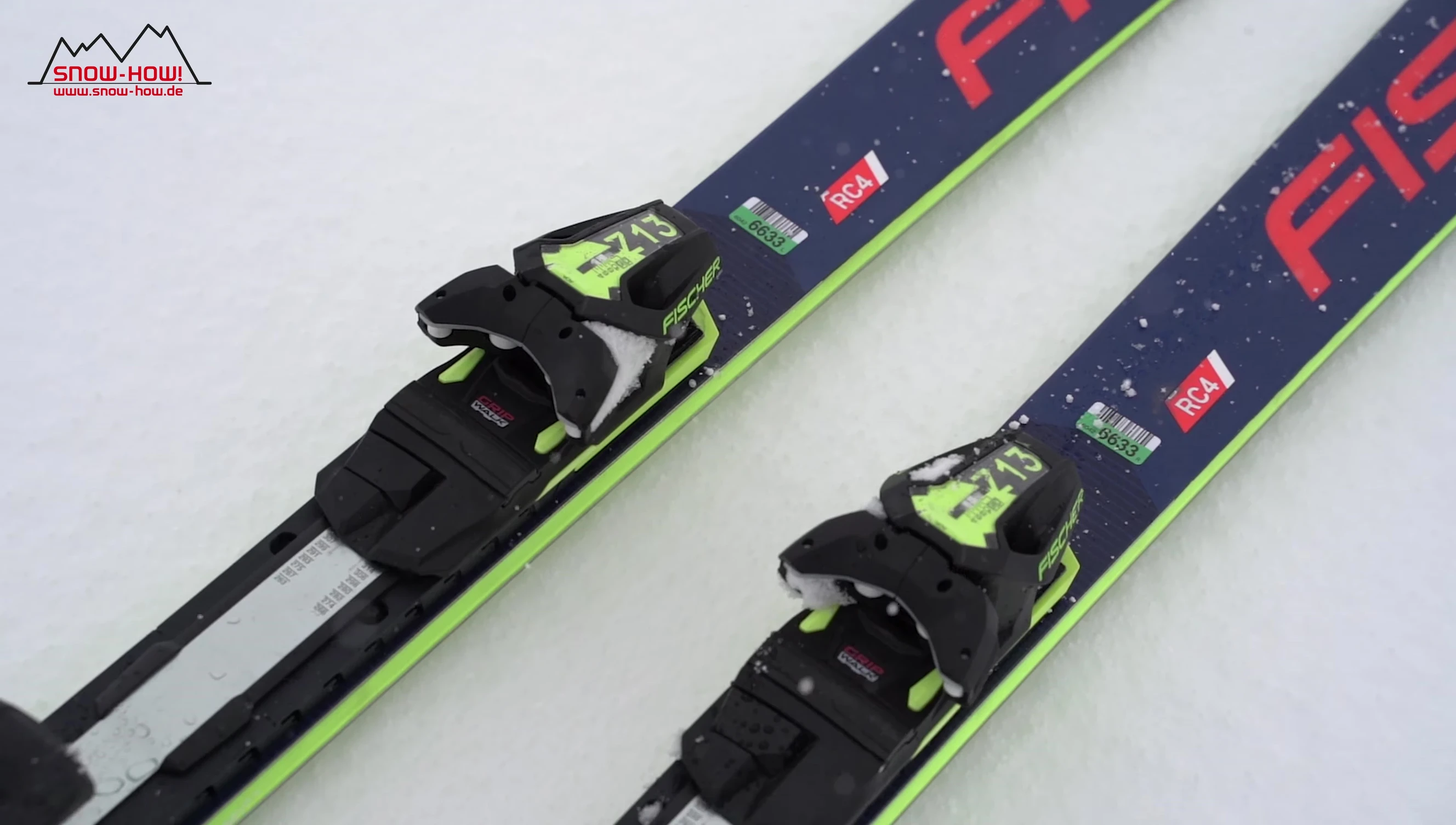 Skier making a powerful turn on Fischer RC4 skis.