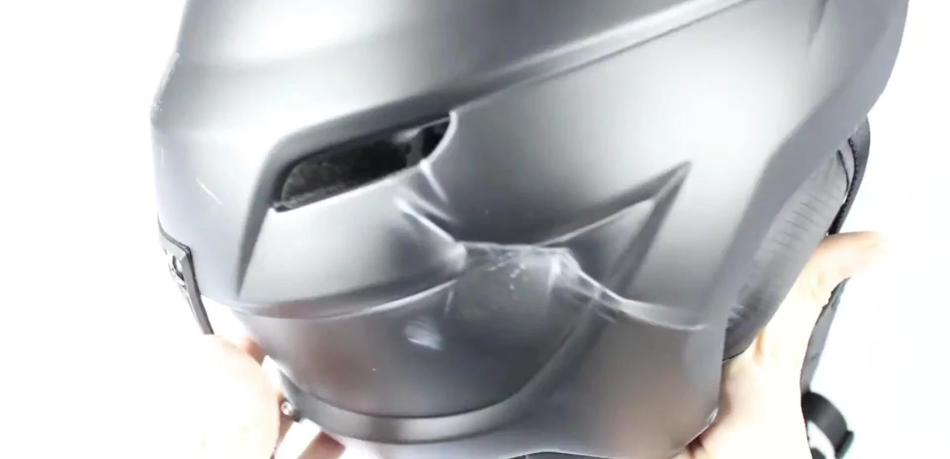 Close-up of a helmet liner being inspected for cracks