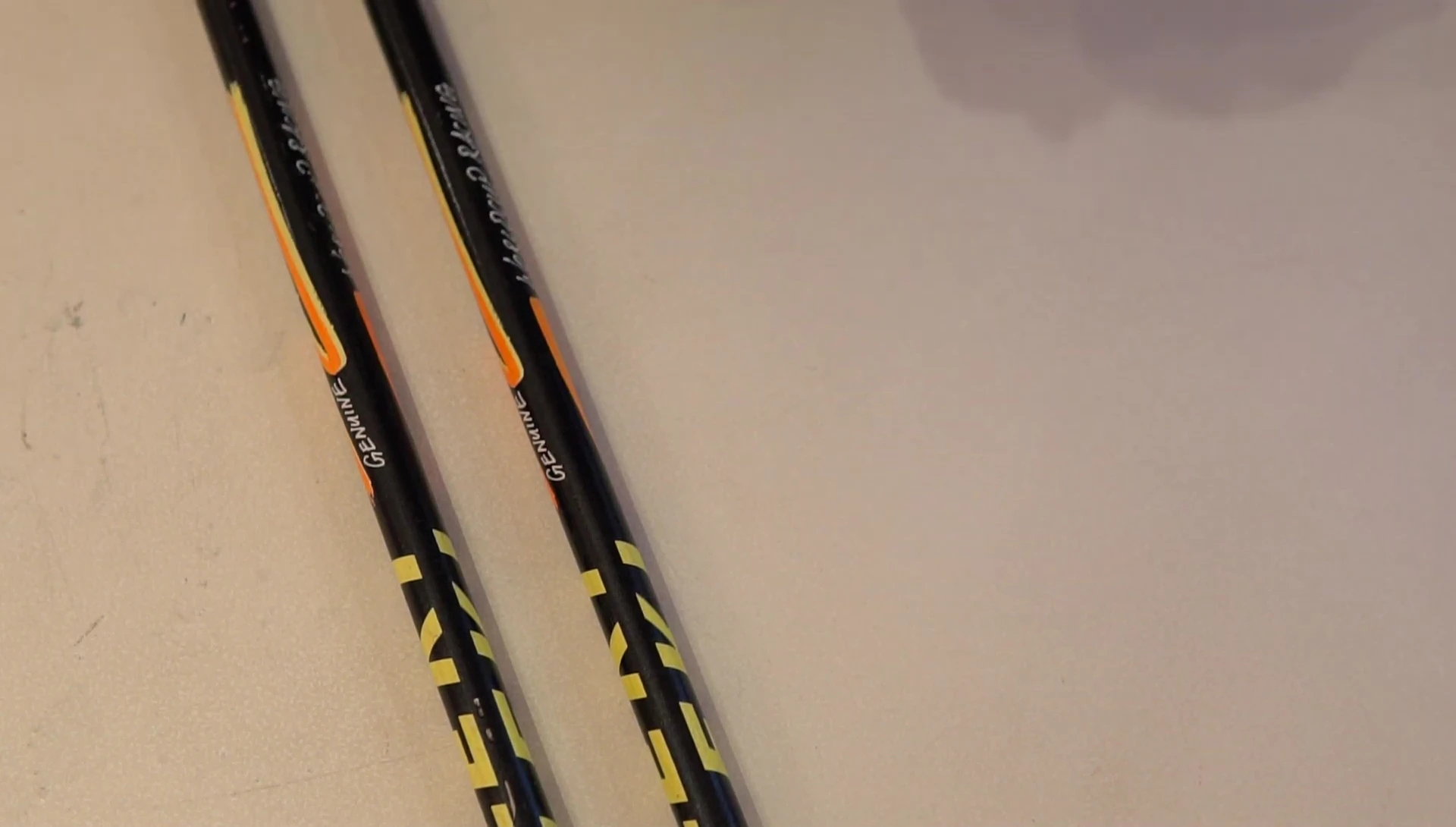 Cleaning the ski poles before applying the bar tape.