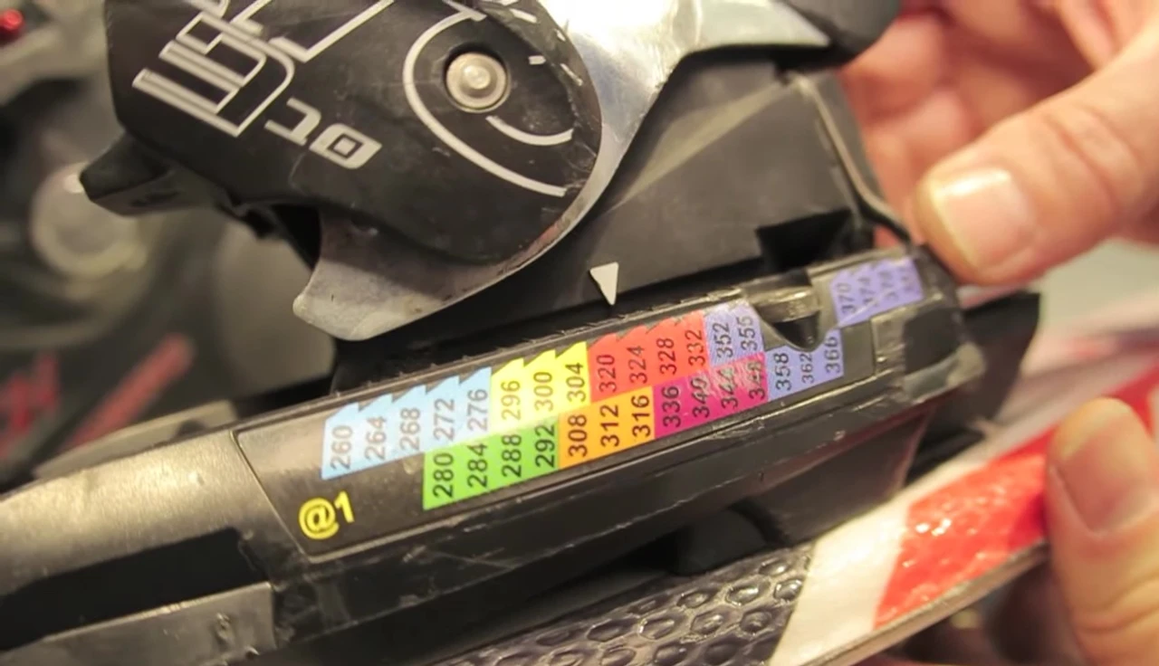 Checking for the metal tab after inserting the boot to adjust the forward pressure