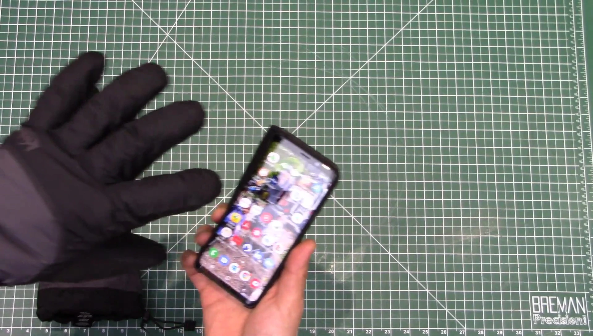 Attempting to use the touchscreen while wearing the gloves