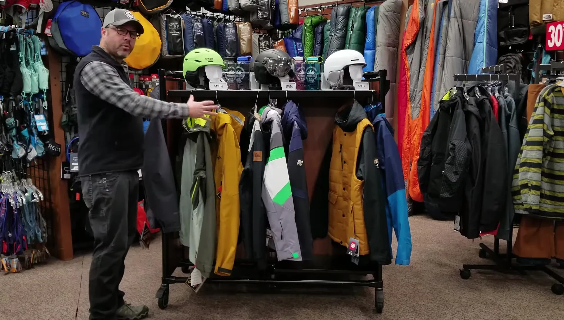 Variety of ski jackets displayed.